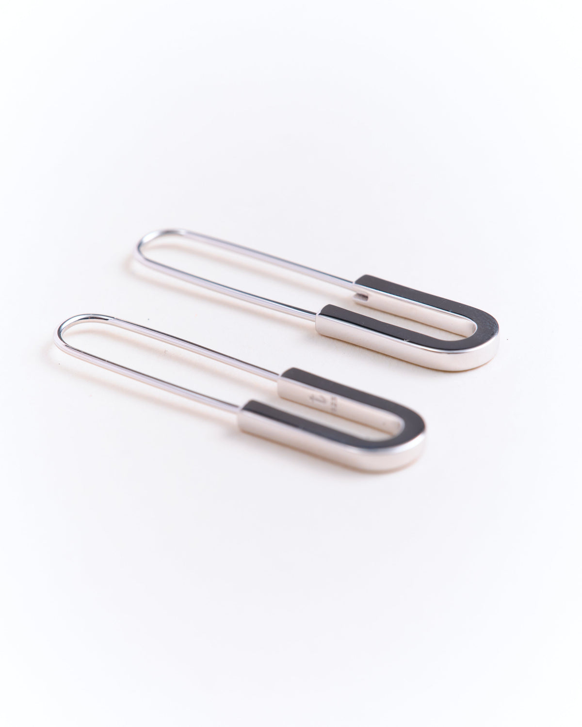 pair of 925 sterling silver earrings on a white background