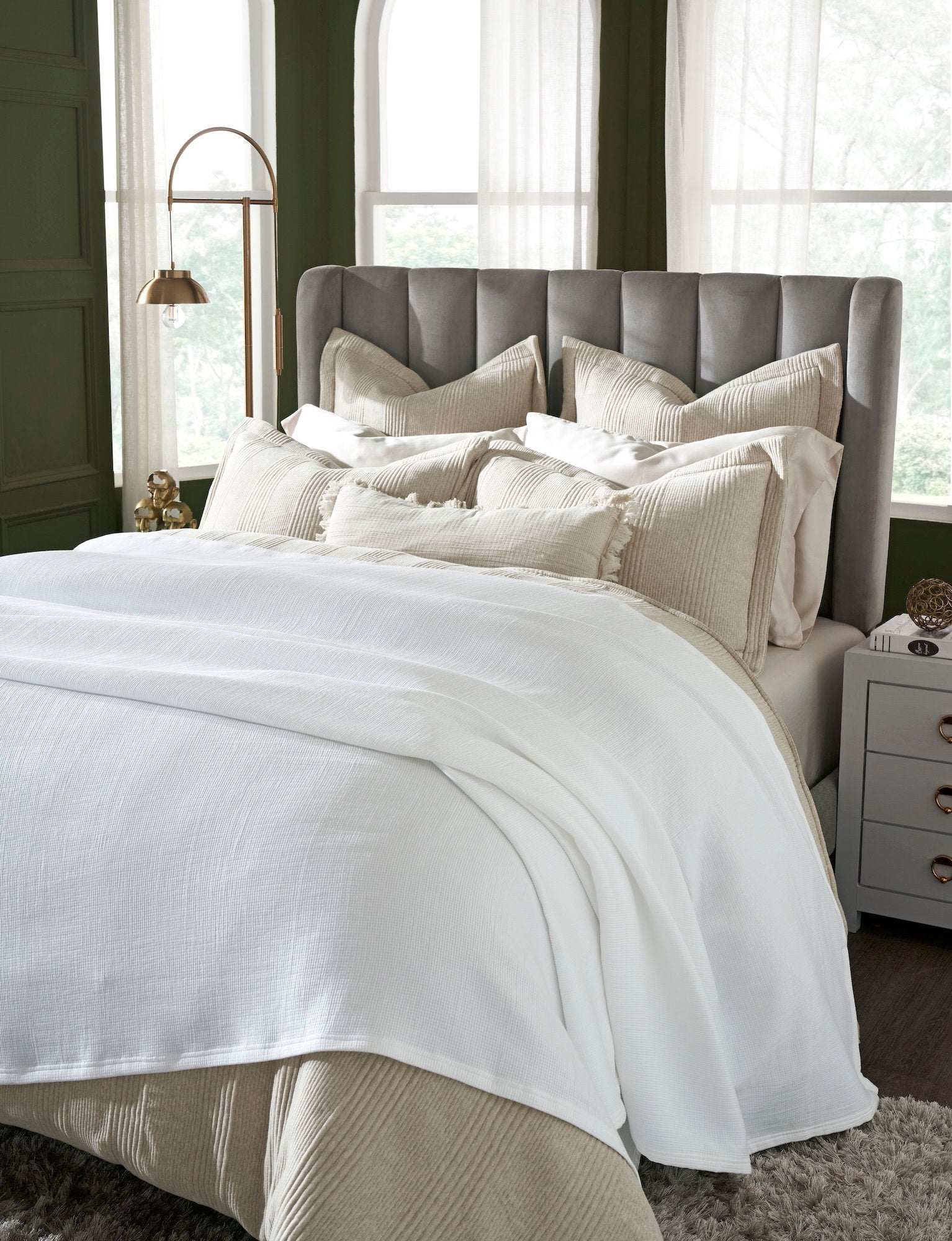 BL-858-11096_3|Crisp white woven blanket elegantly draped over a luxurious bed, adding a touch of comfort and style to the modern bedroom.