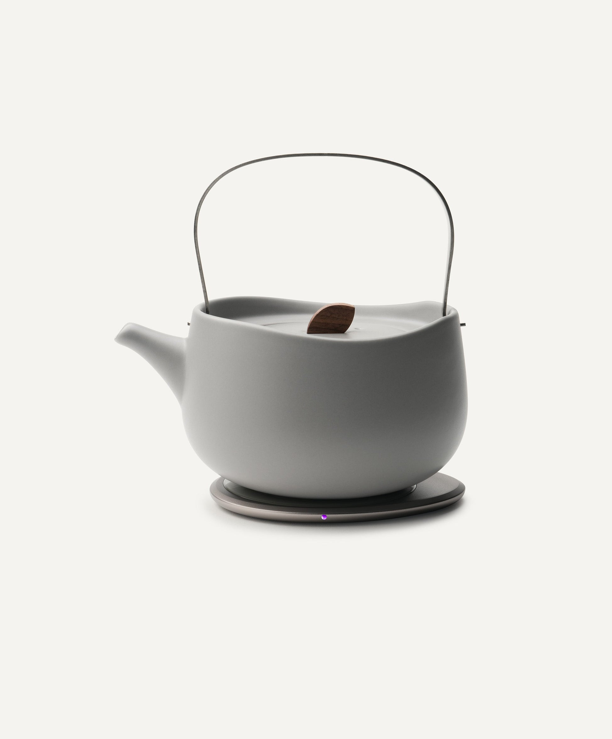 Leiph Self-Heating Ceramic Teapot Set 20 fl oz / 600 mL in Soft Gray on Ohom Charging Pad 3