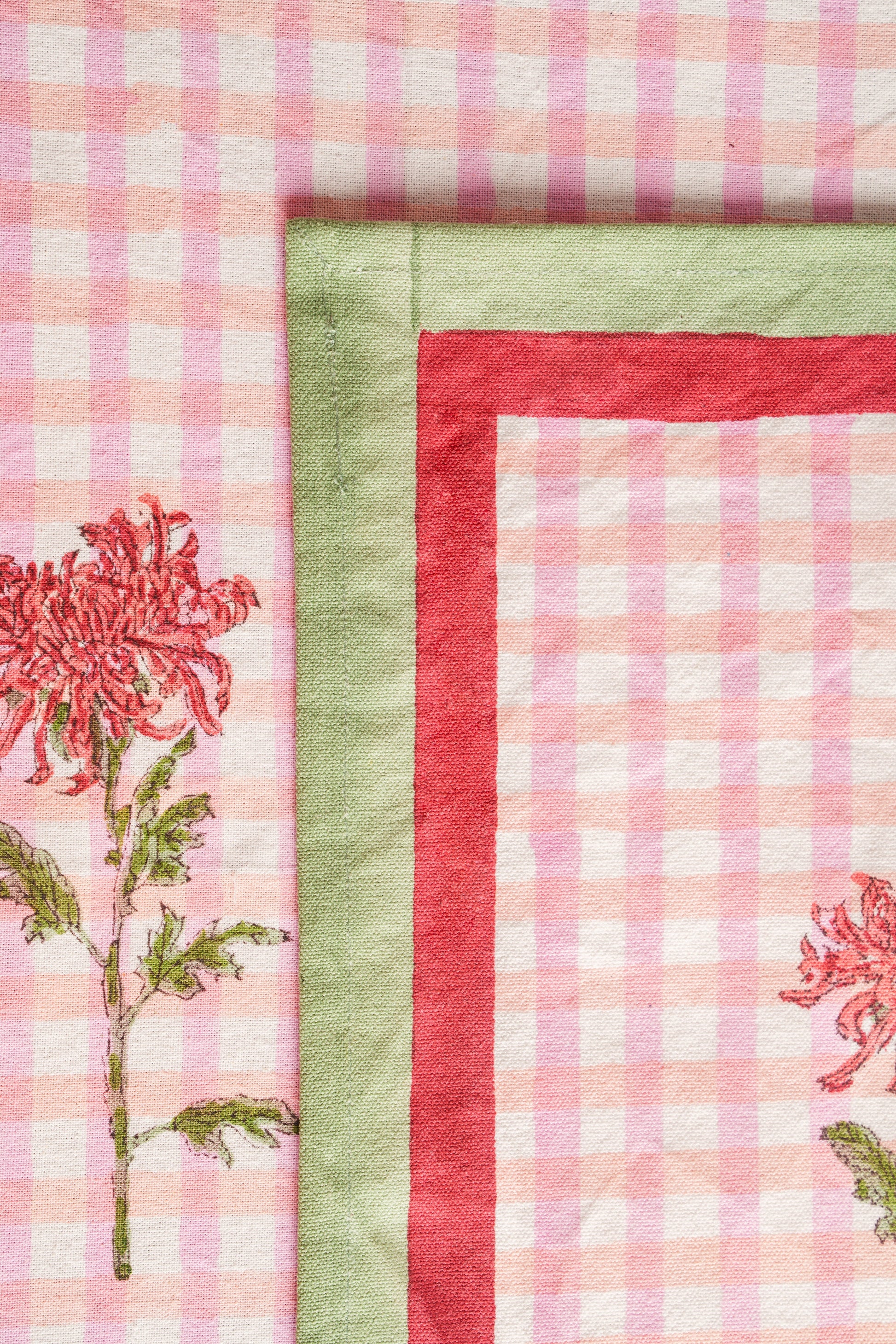 Close-up of pink gingham fabric with dahlia flower embroidery - Inner Child