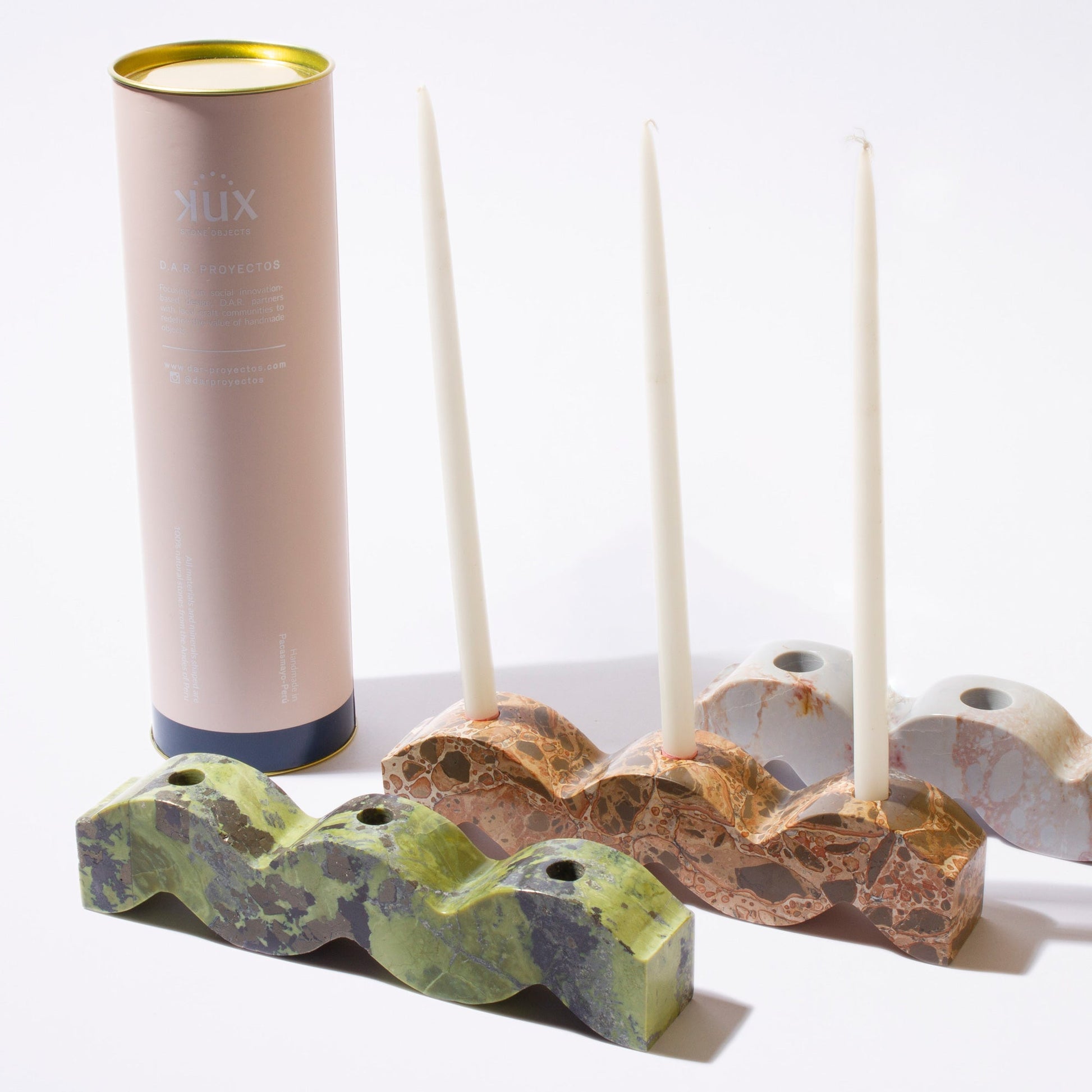Curated collection of wavy gemstone candelabras in natural Andean stones emphasizing their sculptural quiet luxury appeal.
