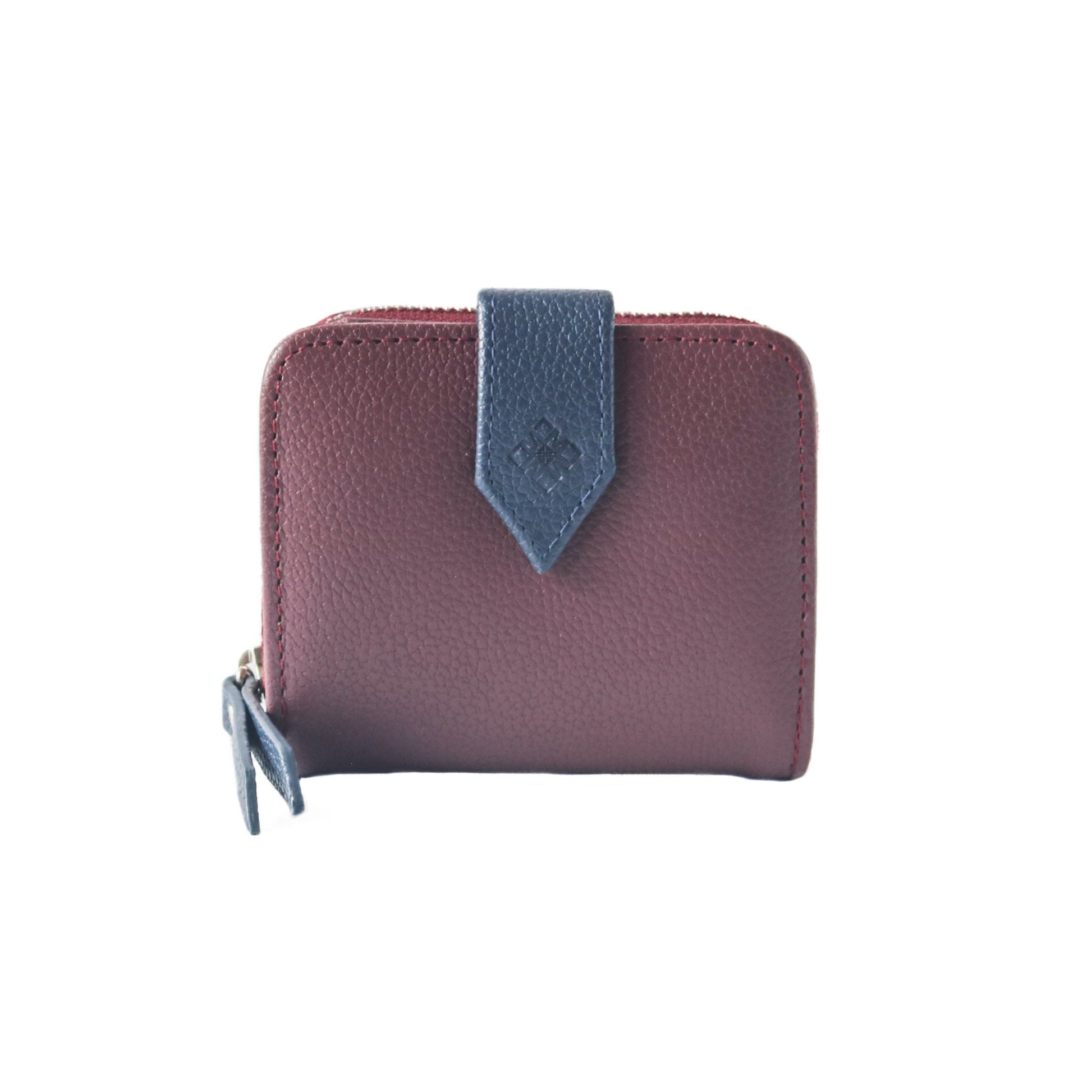 Embossed Tin Marin logo and signet detail on closure flap