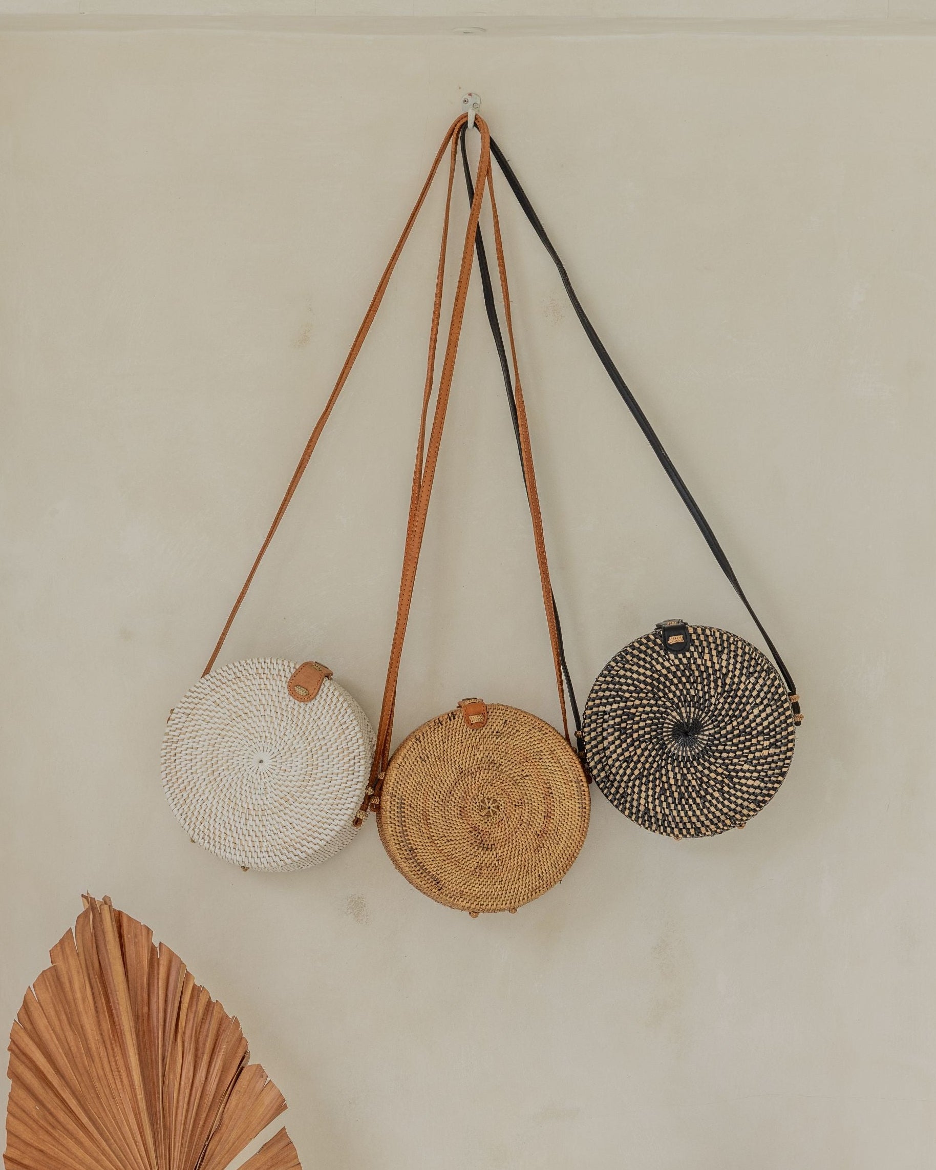 Round Rattan Purse handmade by Village Thrive using natural materials.