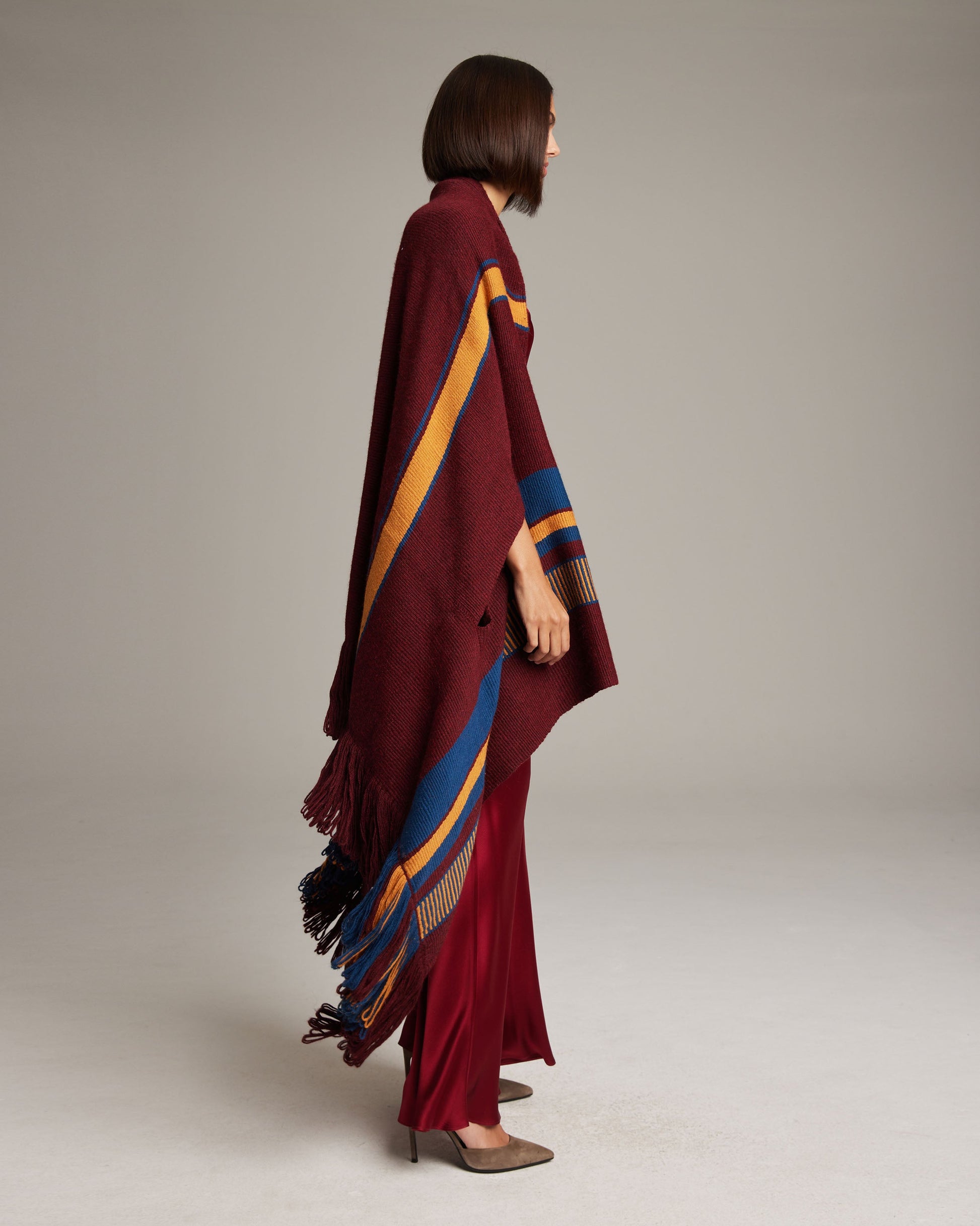 Side view of Cascade Wrap in Baby Alpaca, featuring maroon, yellow, and blue stripes.