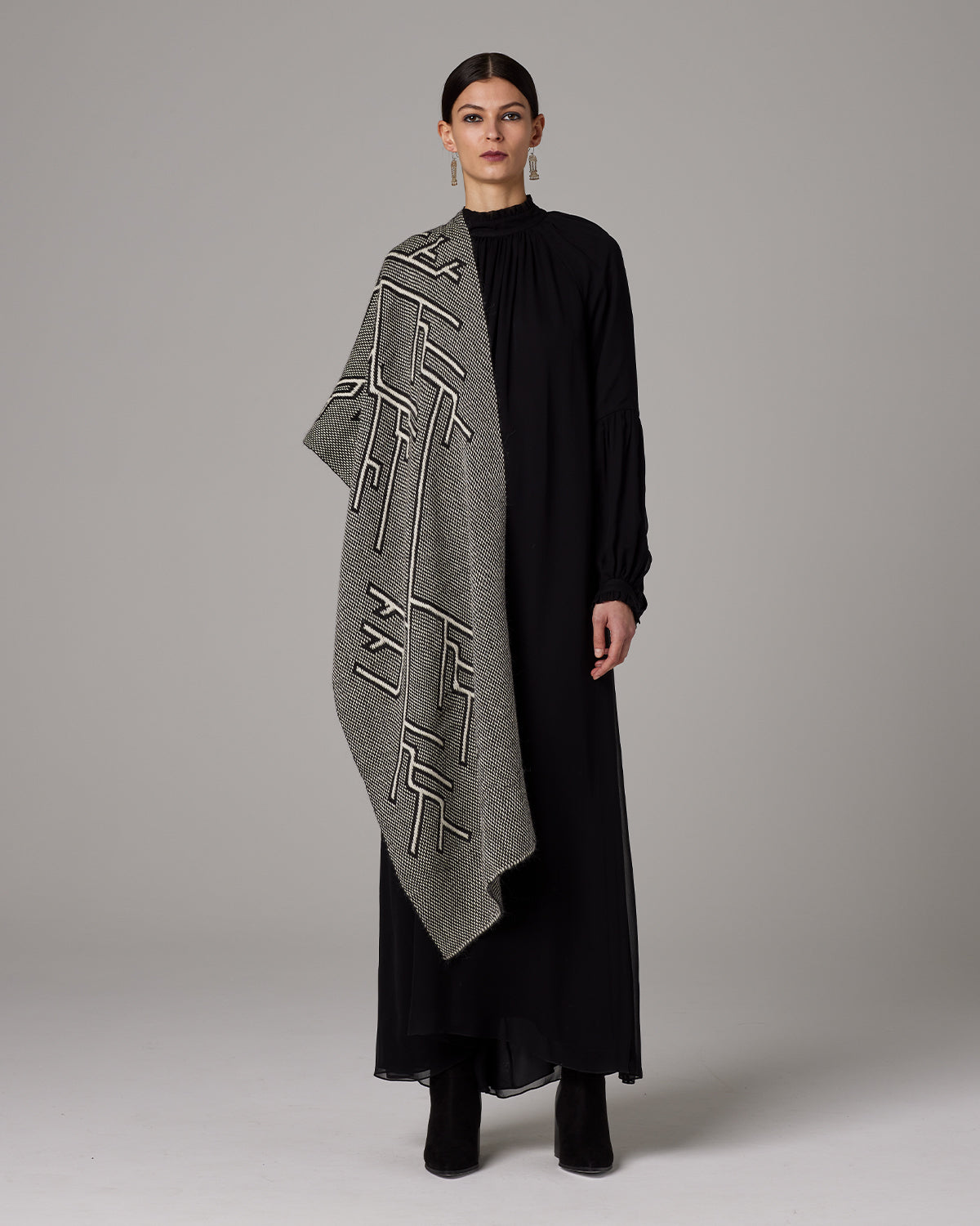 Model wearing Raiz Shawl in Baby Alpaca with geometric design