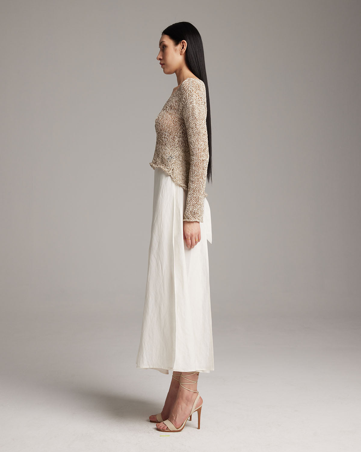 Model wearing a Marble Loose Knit Midlength Crop Sweater, side view