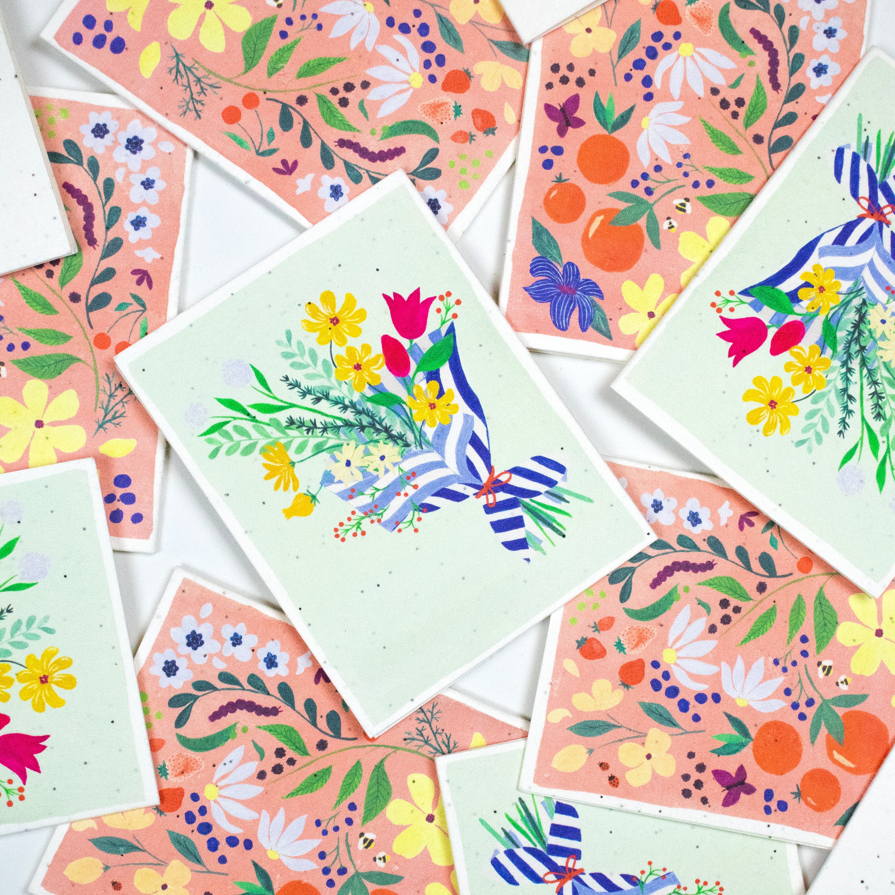 Scattered seed cards showing detailed floral artwork in pink and mint cards, seed cards, bloom seed cards, floral cards,