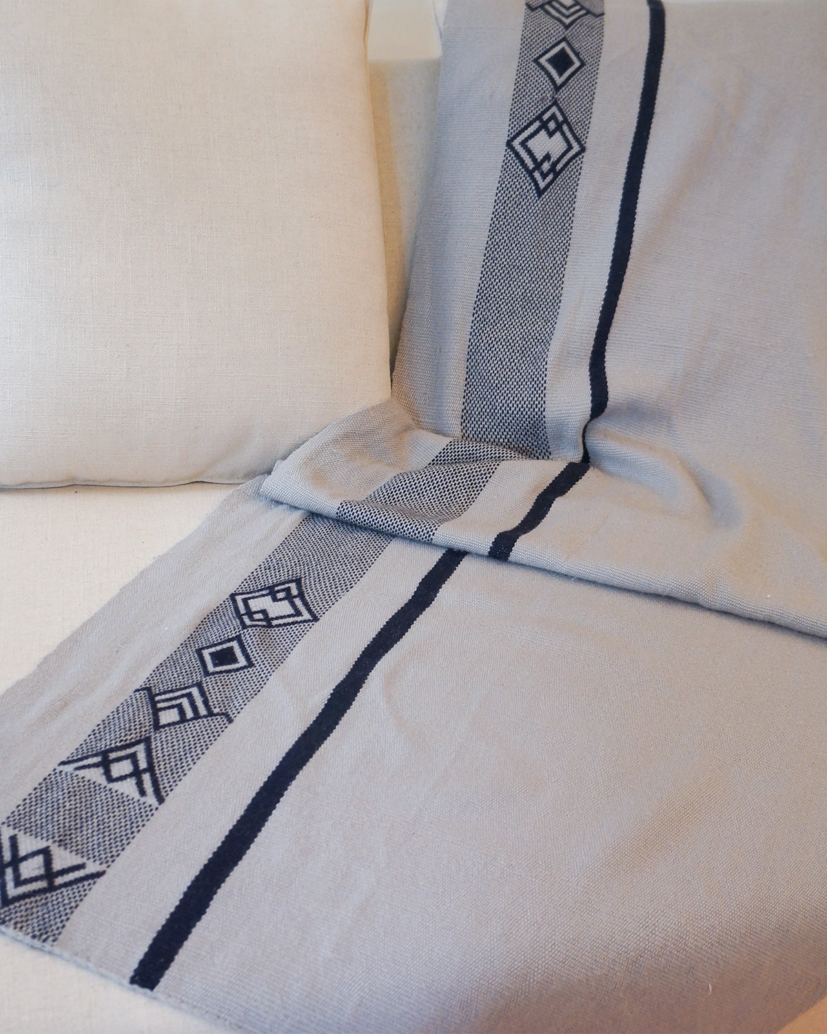 Wide Diagonal Alpaca Wrap in grey with geometric patterns