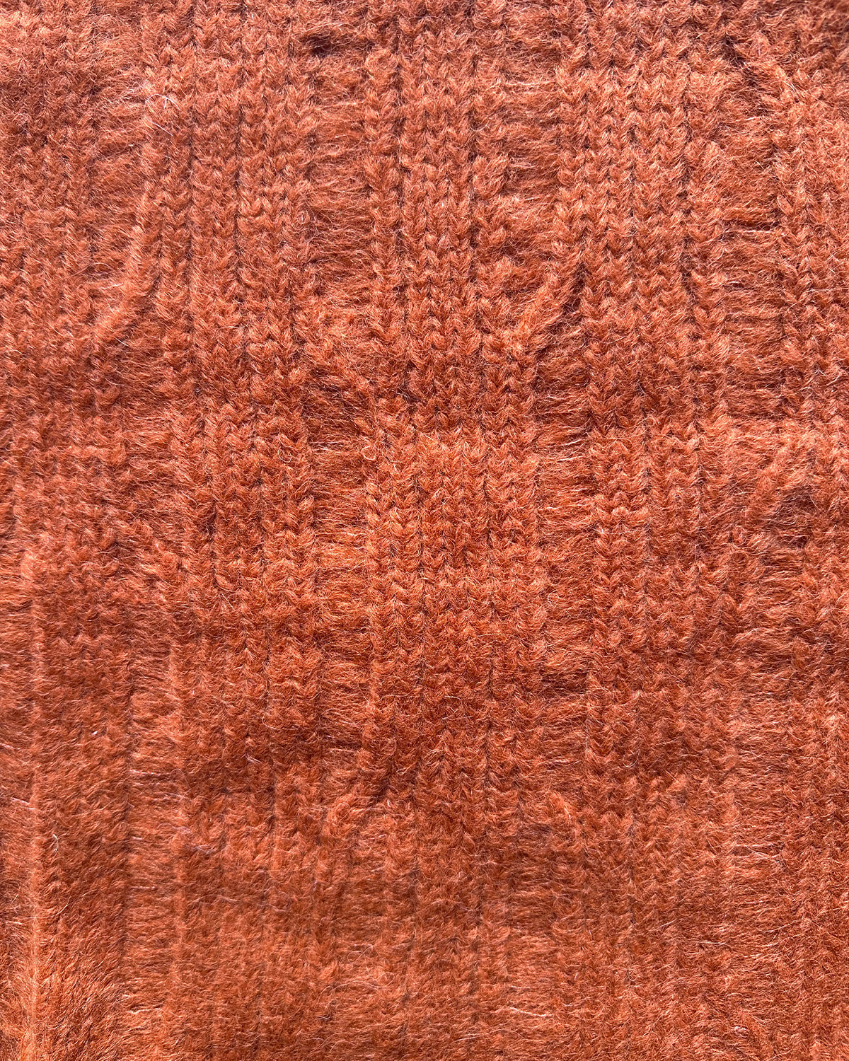Close-up of ribbed fabric in Blood Orange color for Ribbed Cropped Sweater