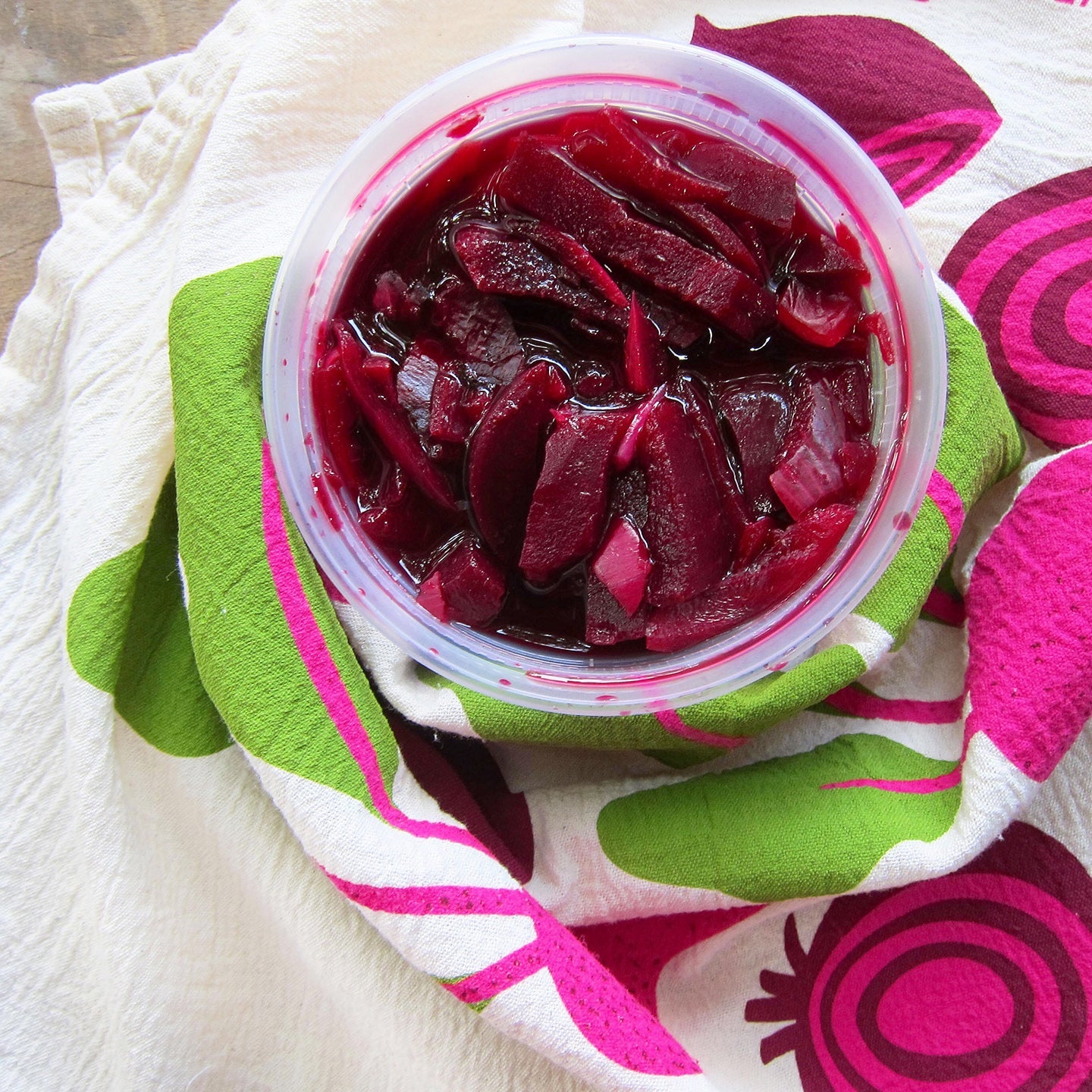 Matching dish towel and sponge cloth set with beets design, featuring the phrase "Beet it"