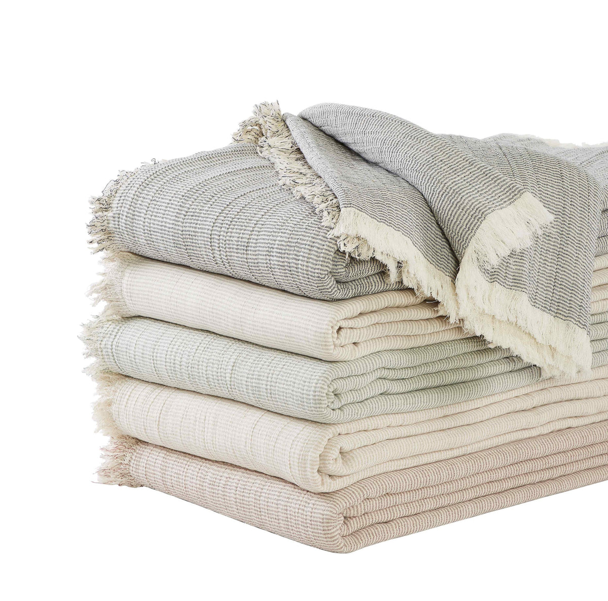 BT-112-9496_5|Stack of cozy striped throw blankets in neutral tones (grey, sage, beige, cream) with fringed edges, soft cotton decor.