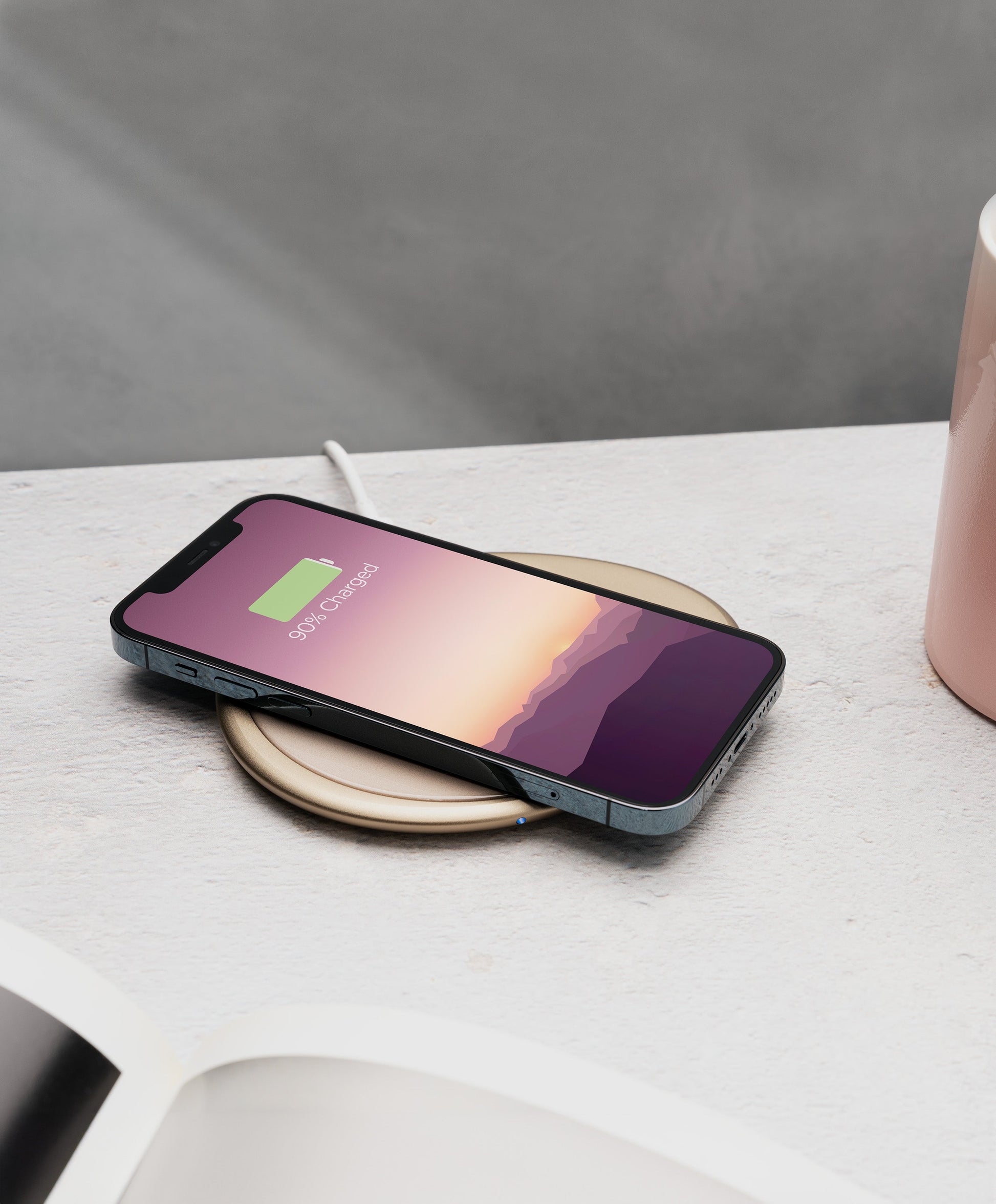 Ui Artist Collection Gold OHOM Pad 3 wirelessly charging iPhone