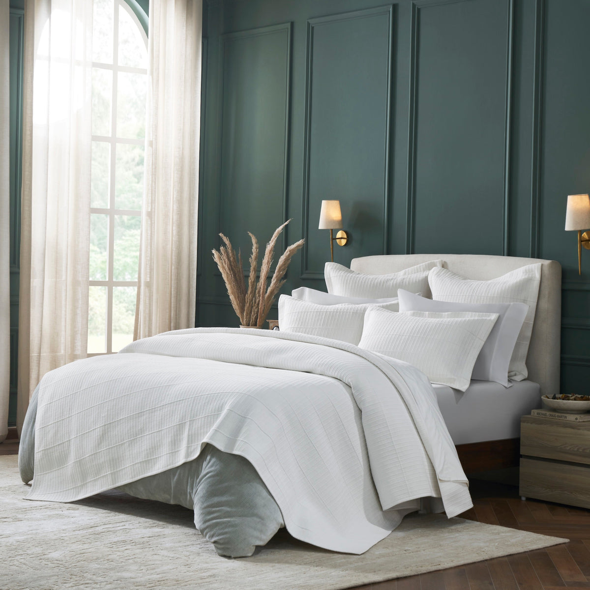 CL-268-9496_2|White textured coverlet featuring a subtle striped pattern, elegantly draped on a modern bed for a luxurious bedroom aesthetic.