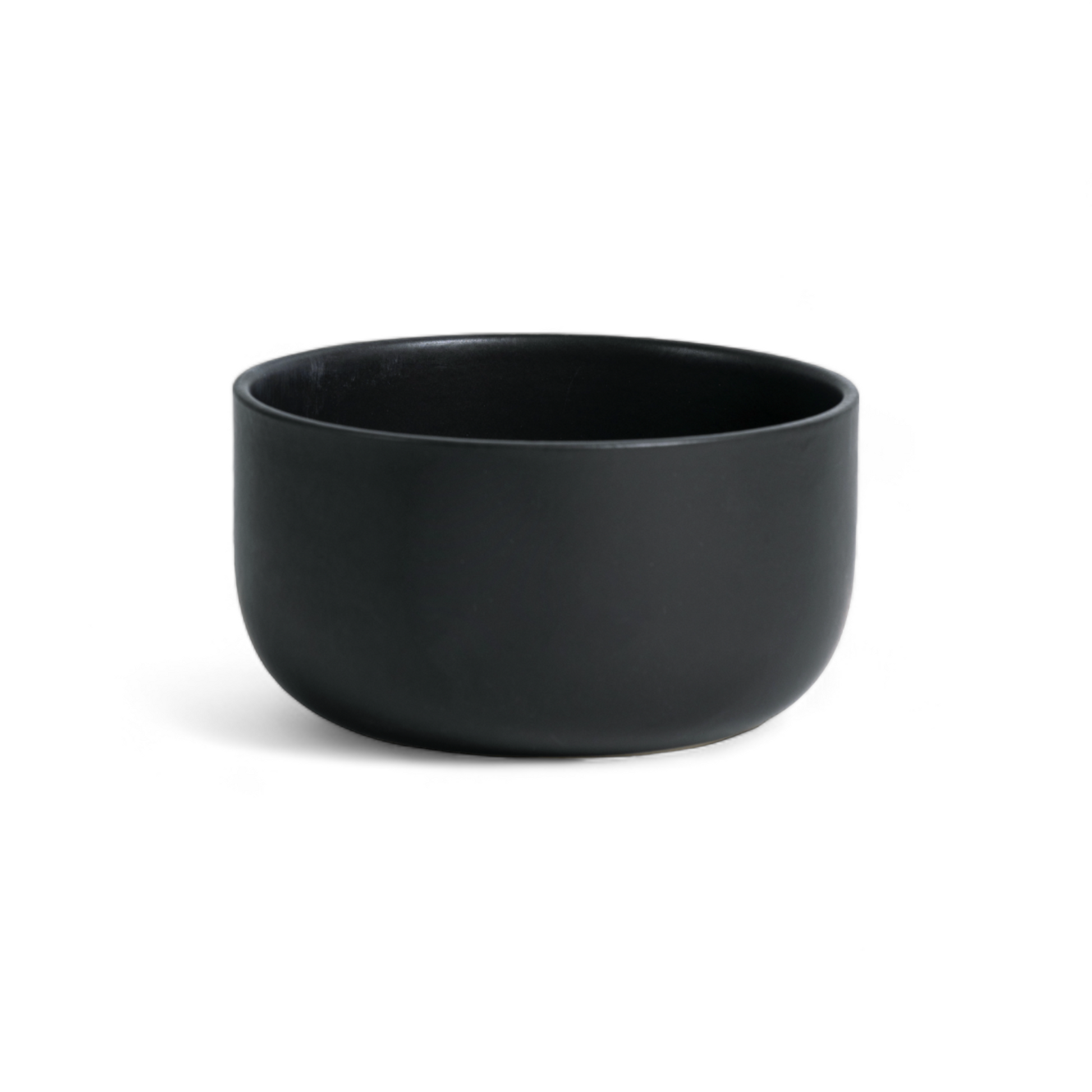 Single matte black stoneware serving bowl displayed against a white background