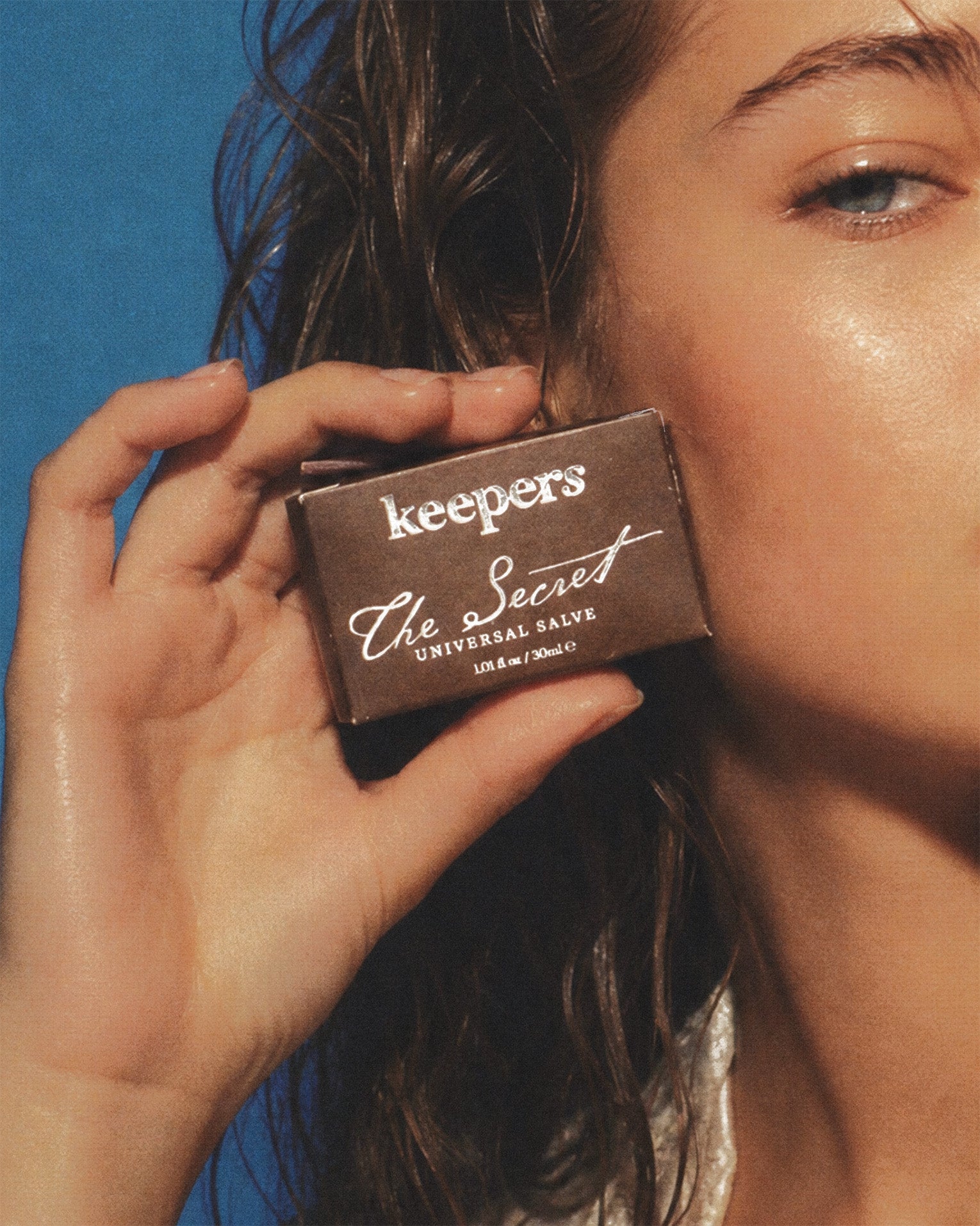 The Secret universal salve tin with Keeper's packaging