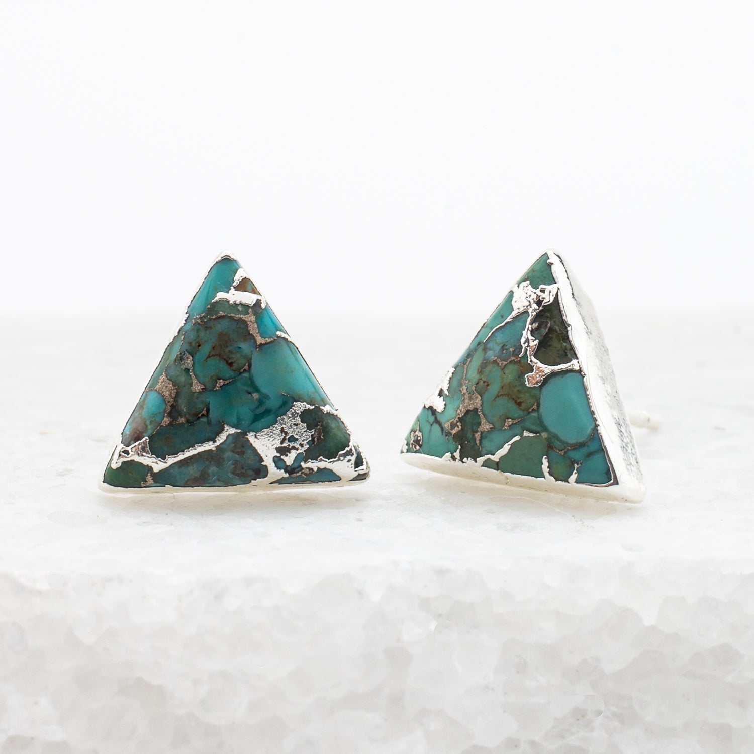 A pair of natural turquoise and silver studs, sustainable fair trade jewelry, women's jewelry, beautiful and quality earrings set against a marble background. Great Christmas present (unique xmas gift), present for Mother's day 