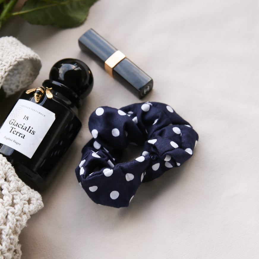 Scrunchie Navy Polka Dot lifestyle — women's cotton navy polka dot scrunchie