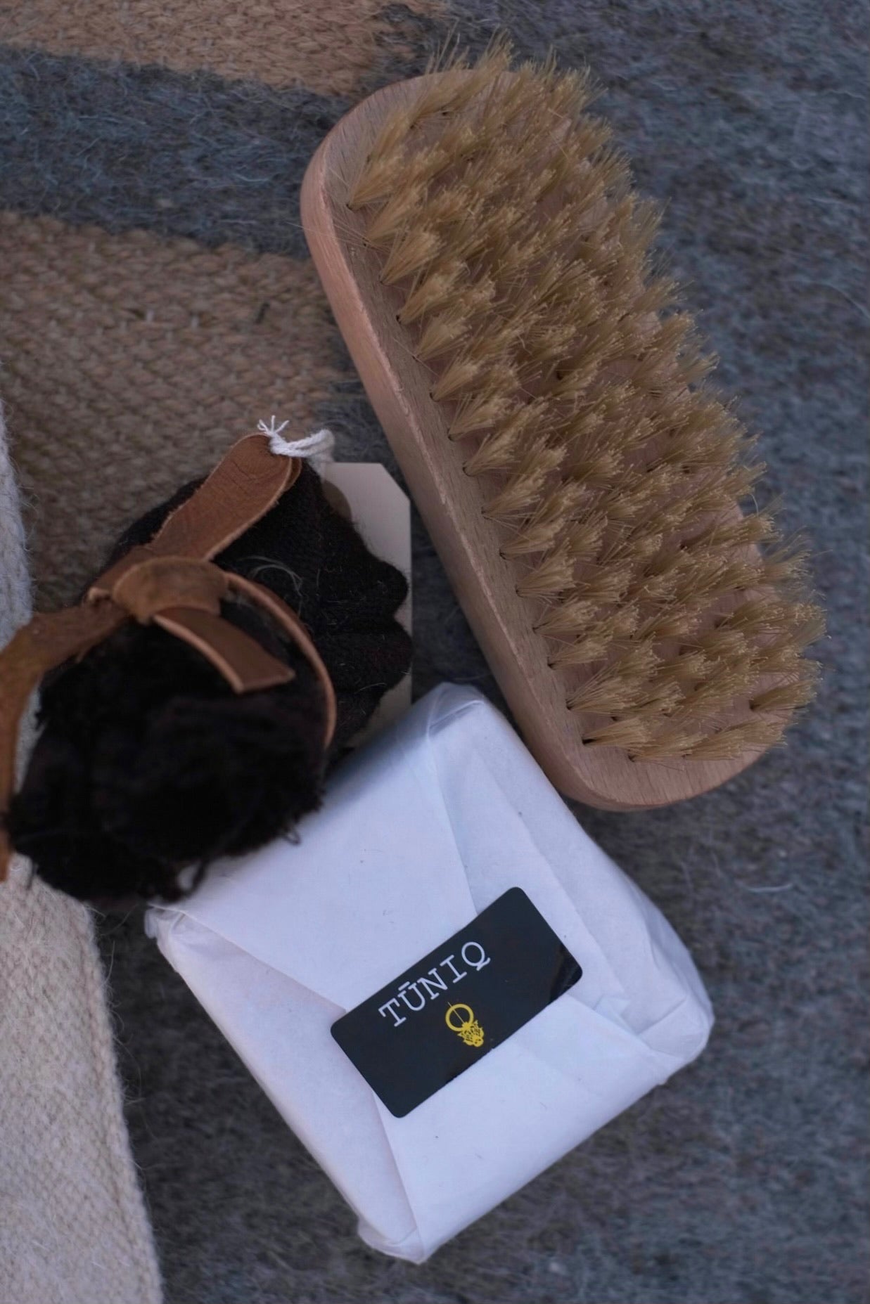 Handmade olive oil soap to hand-wash delicate wool items Wooden brush with natural bristles to de-pill and clean your garments Organic Incense to smoke over wool, protect it, and repel moths Short printed guide to Indigenous Wool Care