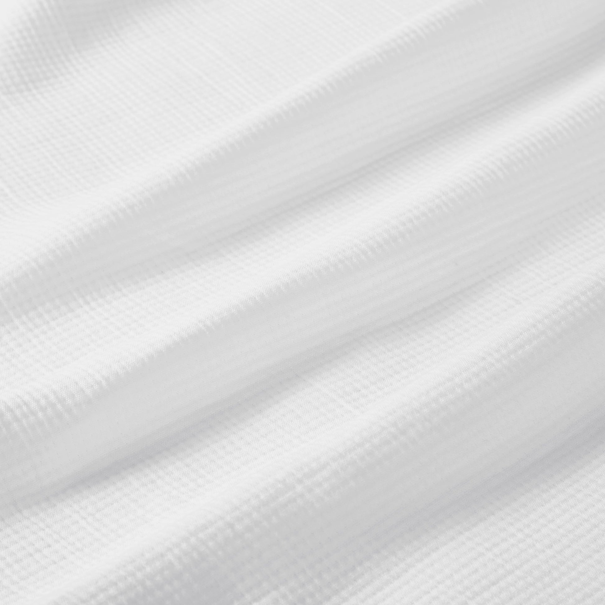 BL-858-11096_9|Close-up of white waffle weave blanket texture. Soft, breathable cotton blanket for cozy layering, providing comfort and simple elegance.