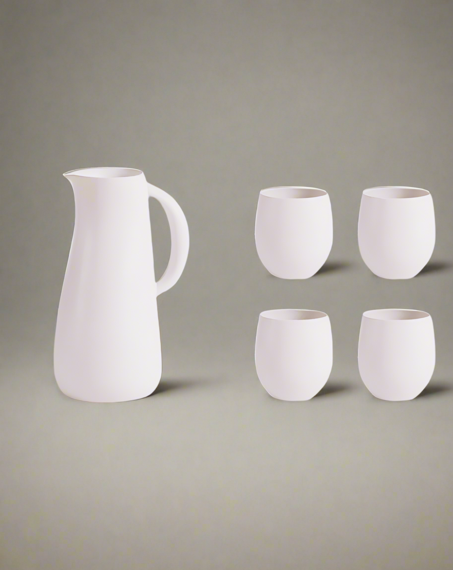 A stoneware jug in green color accompanied by four matching cups, displayed against a neutral background.