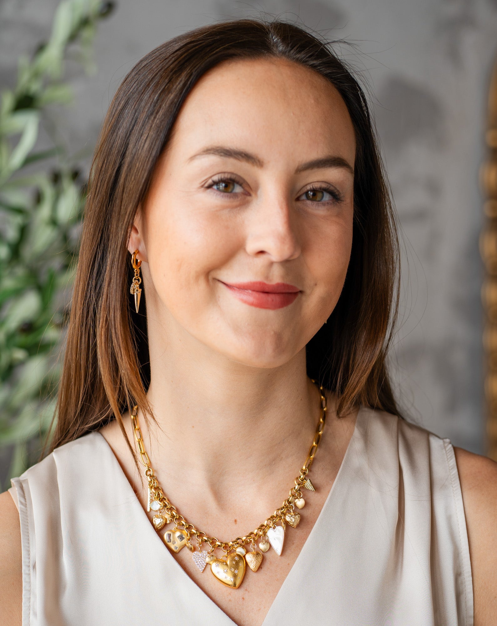 Handmade gold heart necklace with oversized sculptural heart charm, styled for everyday wear.