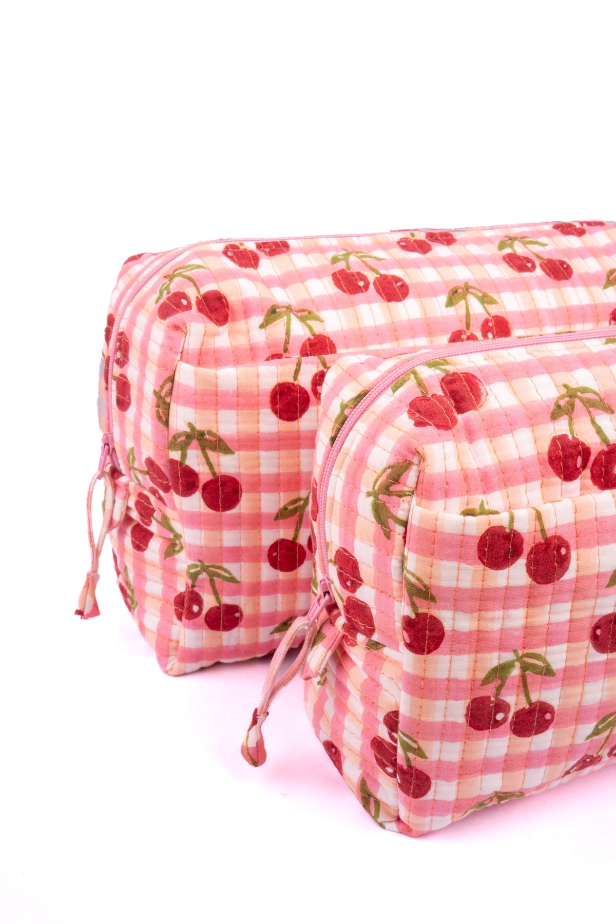 Cherry makeup bag in red gingham blockprint with cherry motifs