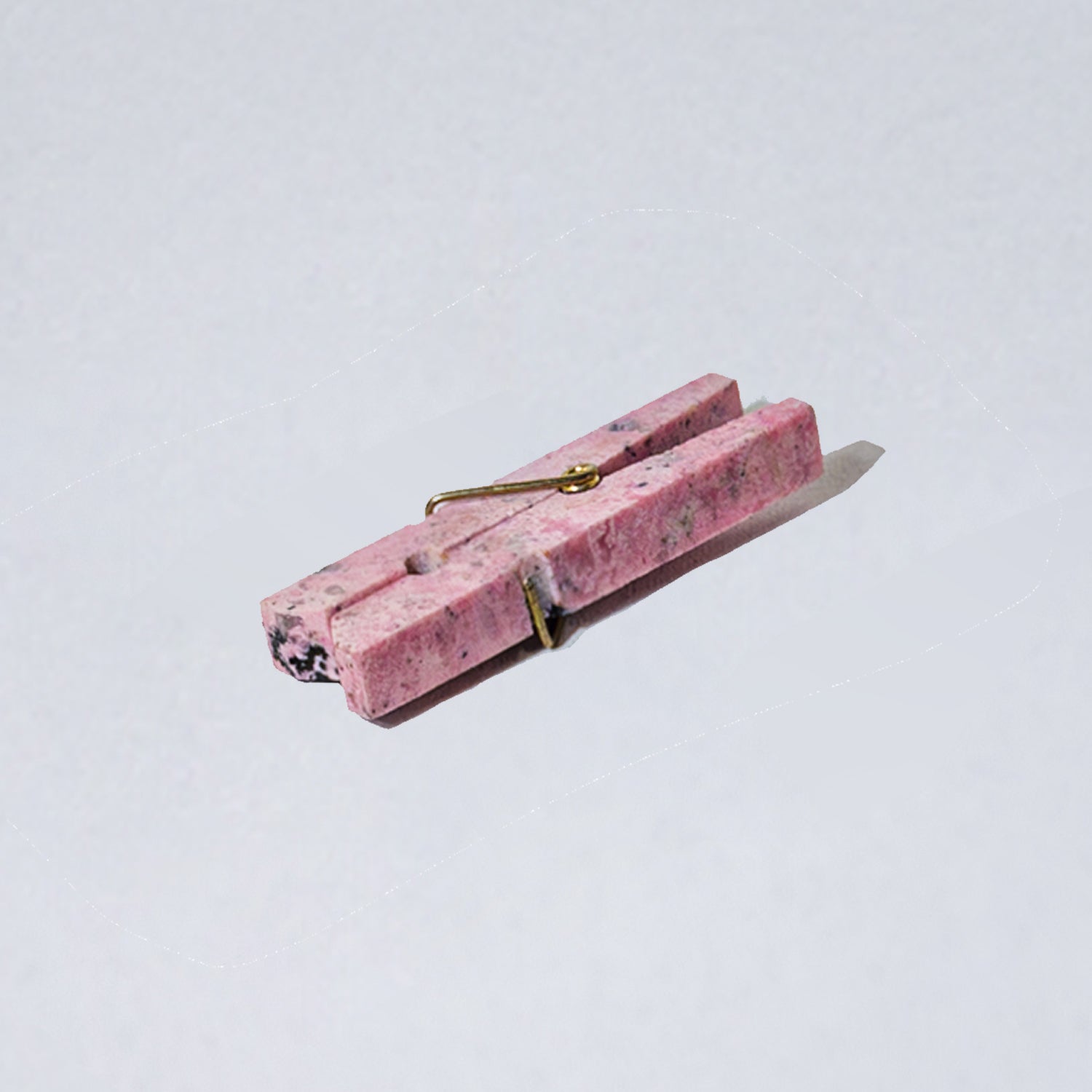 Rhodonite pink decorative gemstone laundry clip showcasing natural warm hues on a white background.