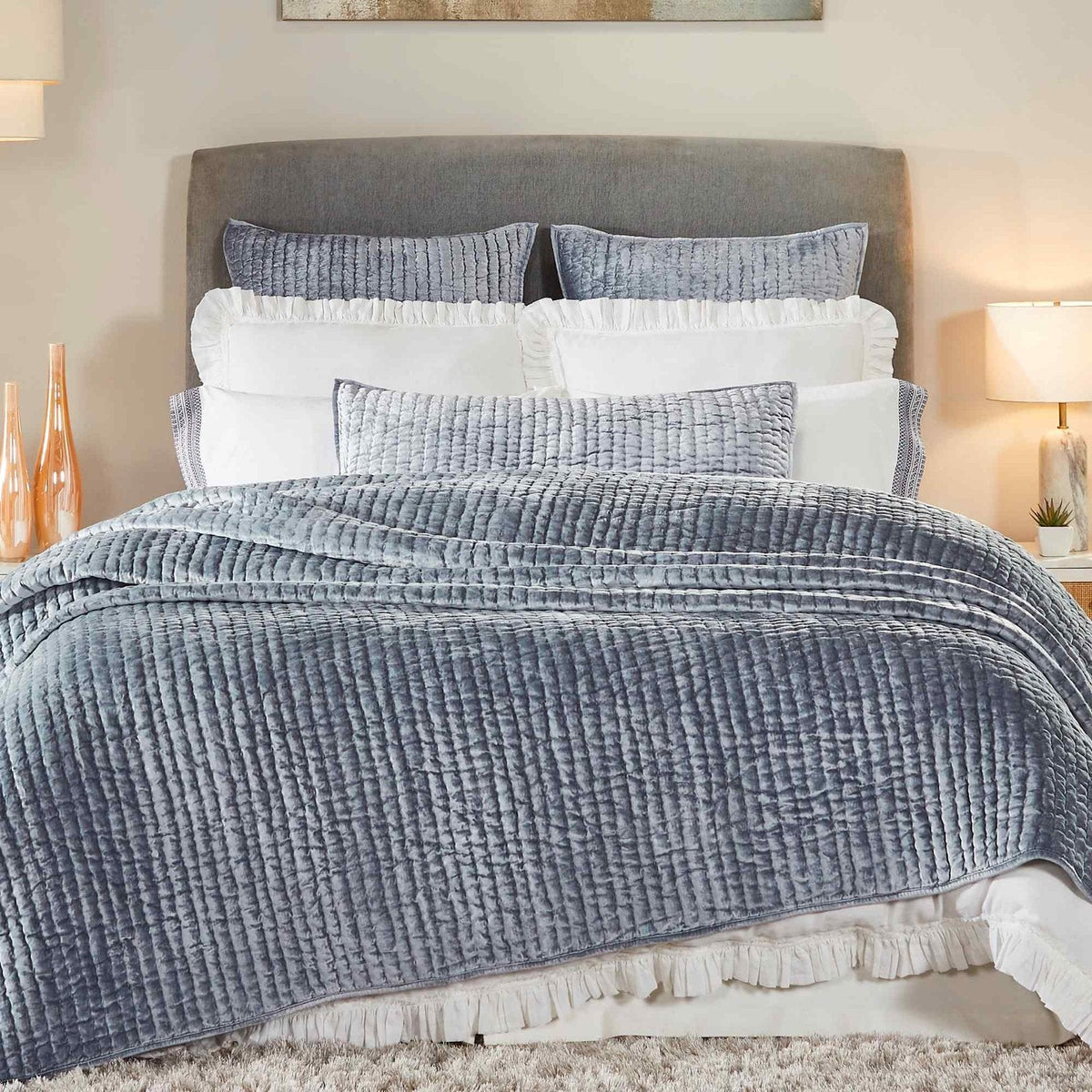 QT-340-X_1|Dusty blue quilted coverlet draped on a bed, featuring a tactile, ribbed texture. Creates a calm, luxurious bedroom oasis.