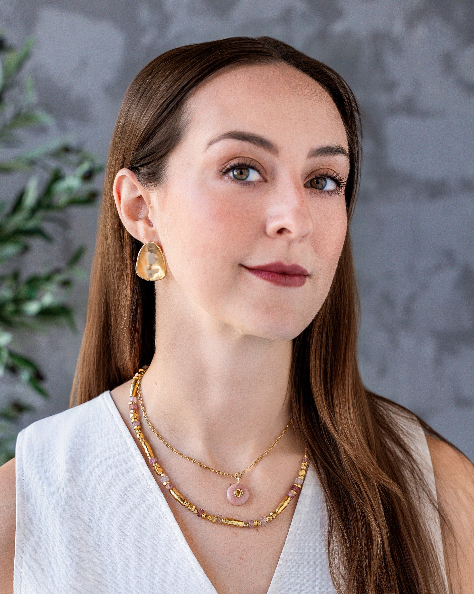 Necklace with pink strawberry quartz beads and organic gold-tone beads in an alternating organic pattern.