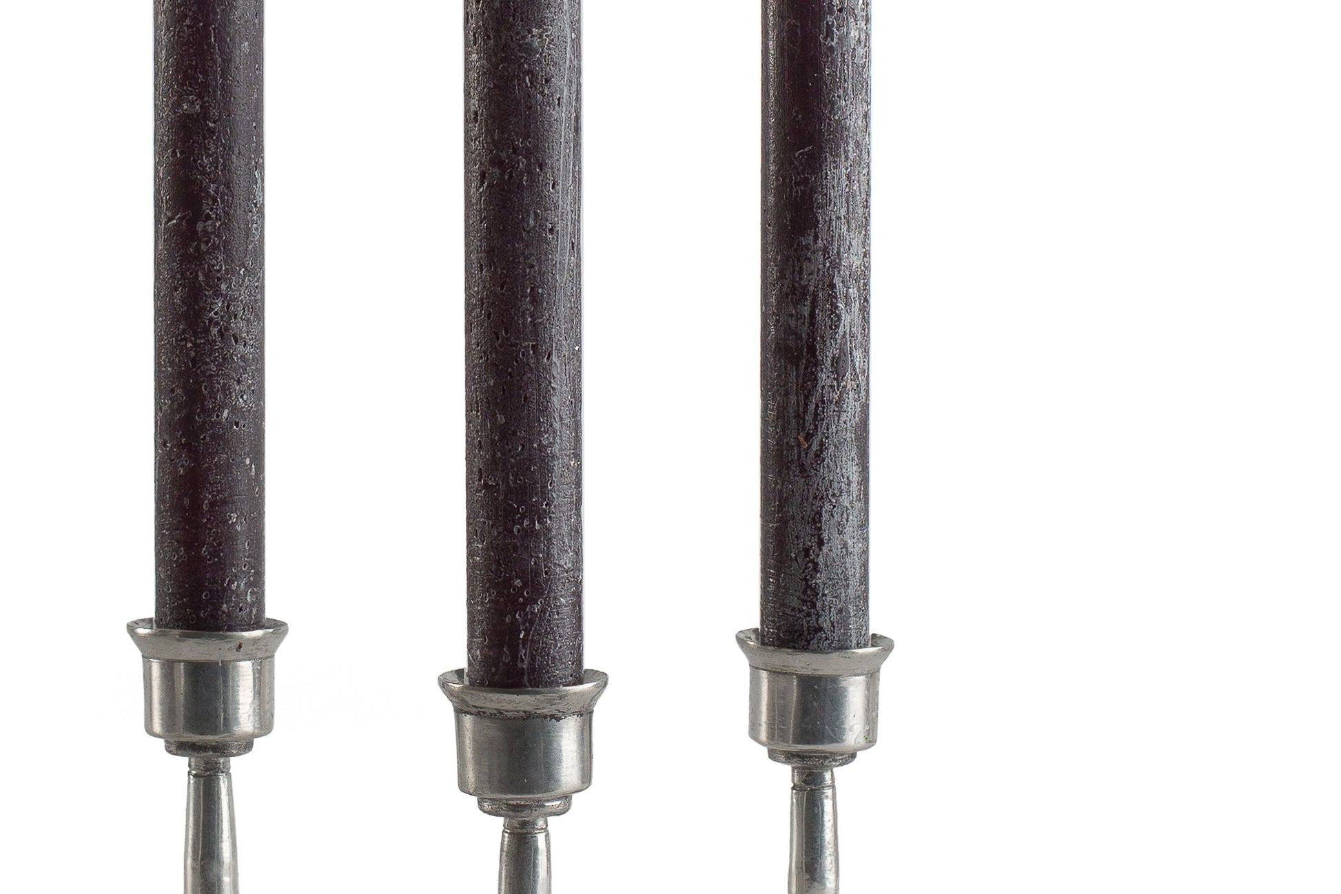 Close up of 3 black frosted Luma Afrika tapers to show the 'frosted' finish