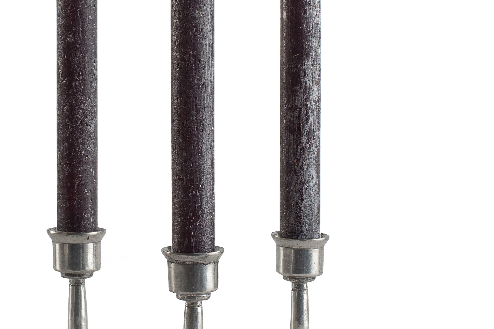 Close up of 3 black frosted Luma Afrika tapers to show the 'frosted' finish