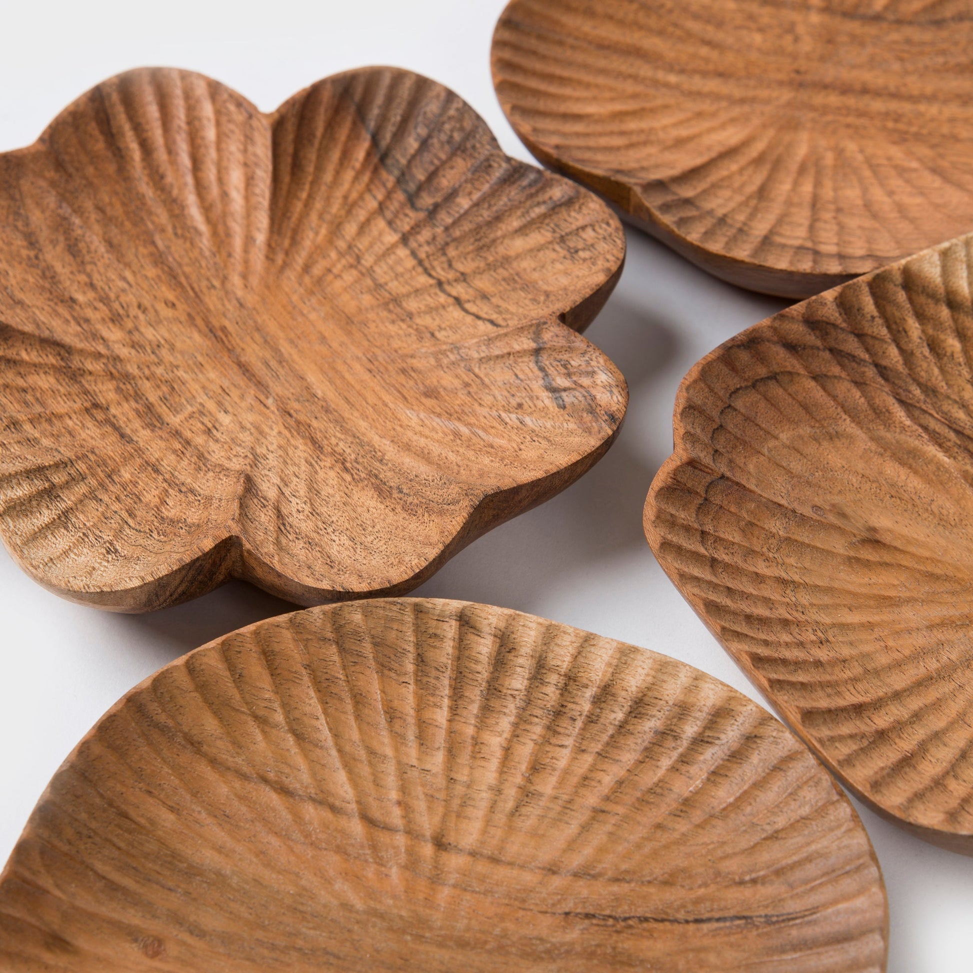 Close-up of hand-carved wood texture and natural grain on trinket tray