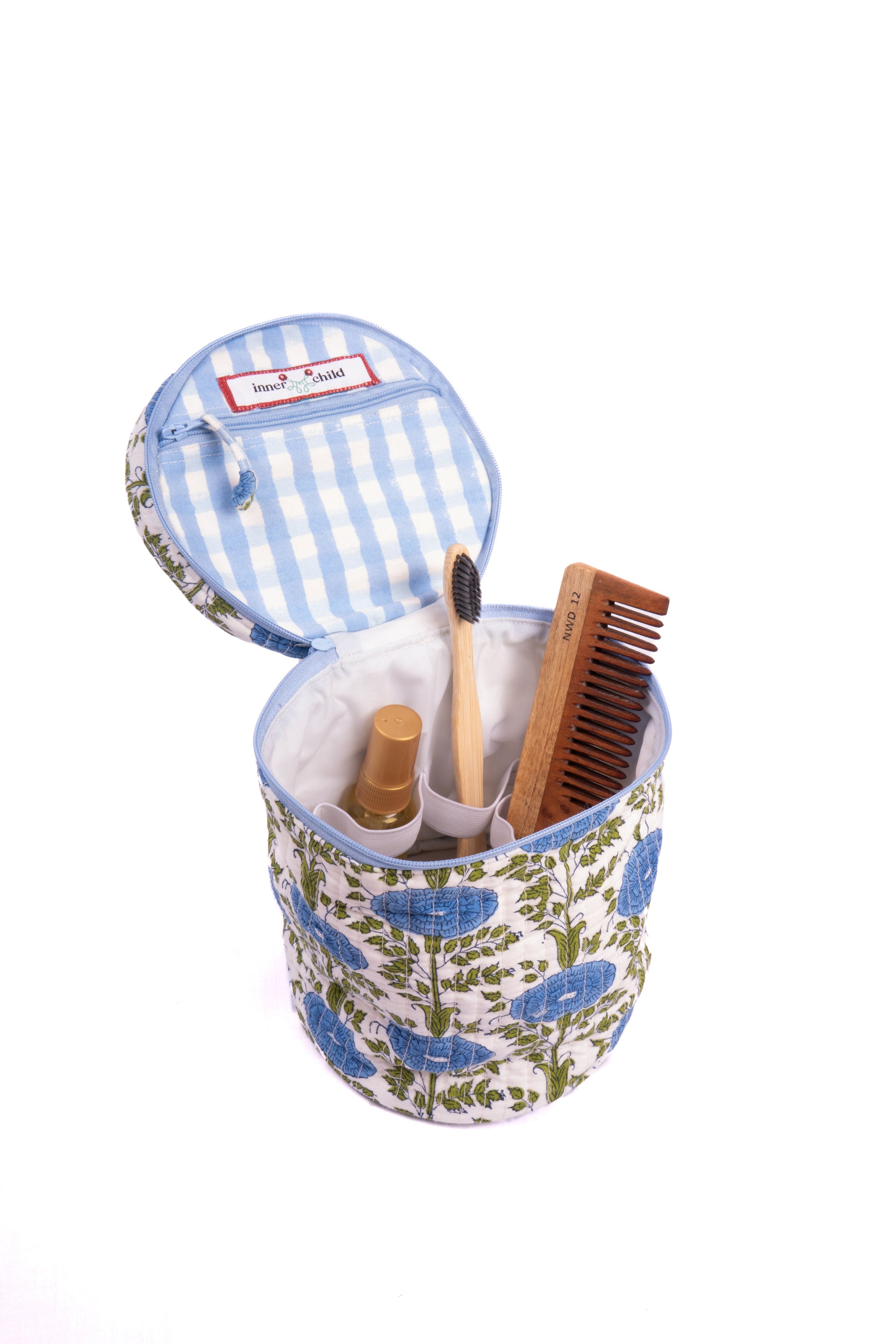 Blue Araminta Round Upright Makeup Bag with items inside