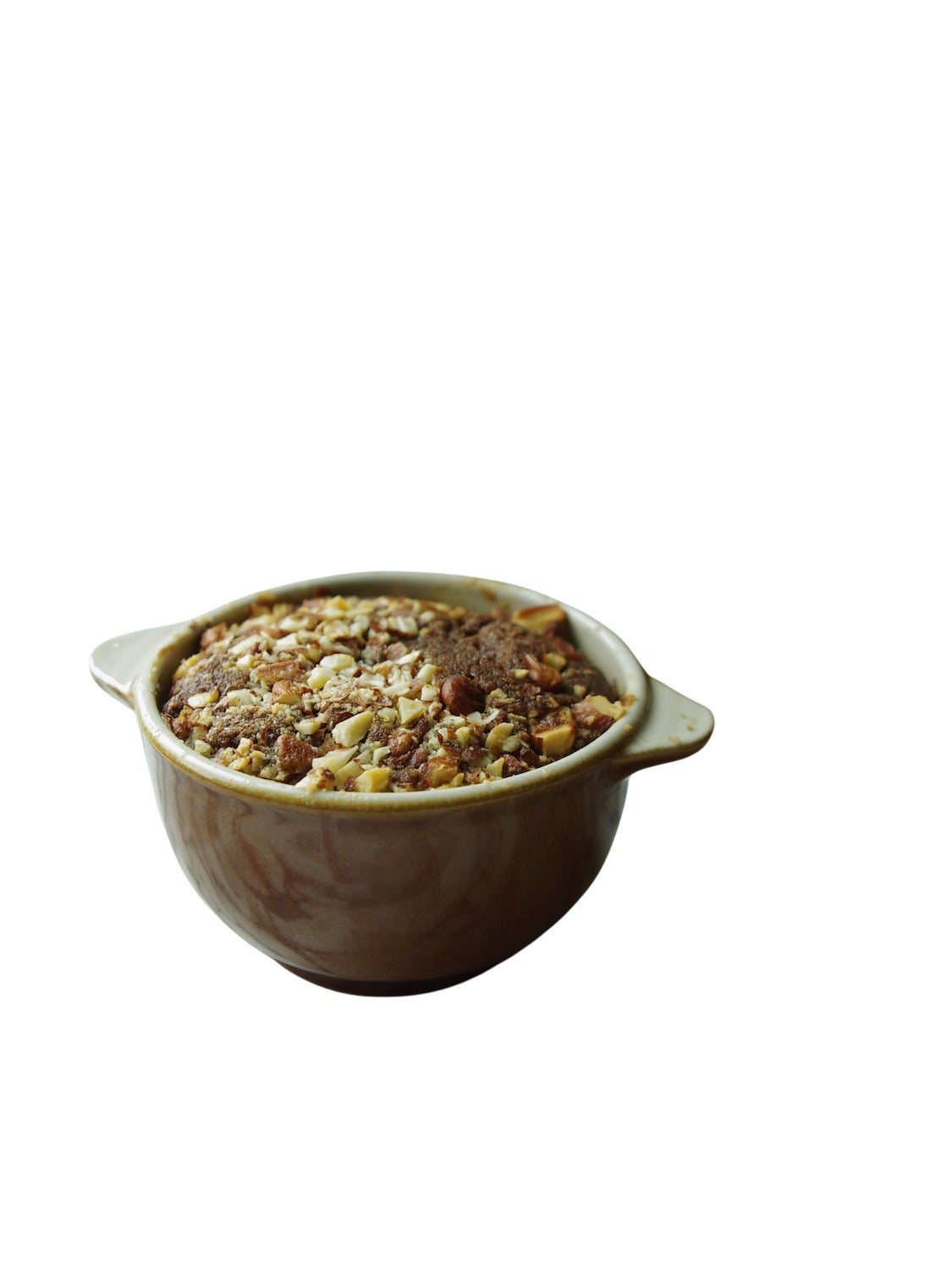 Two brown handled bowls on a marble counter holding a baked nut bread.