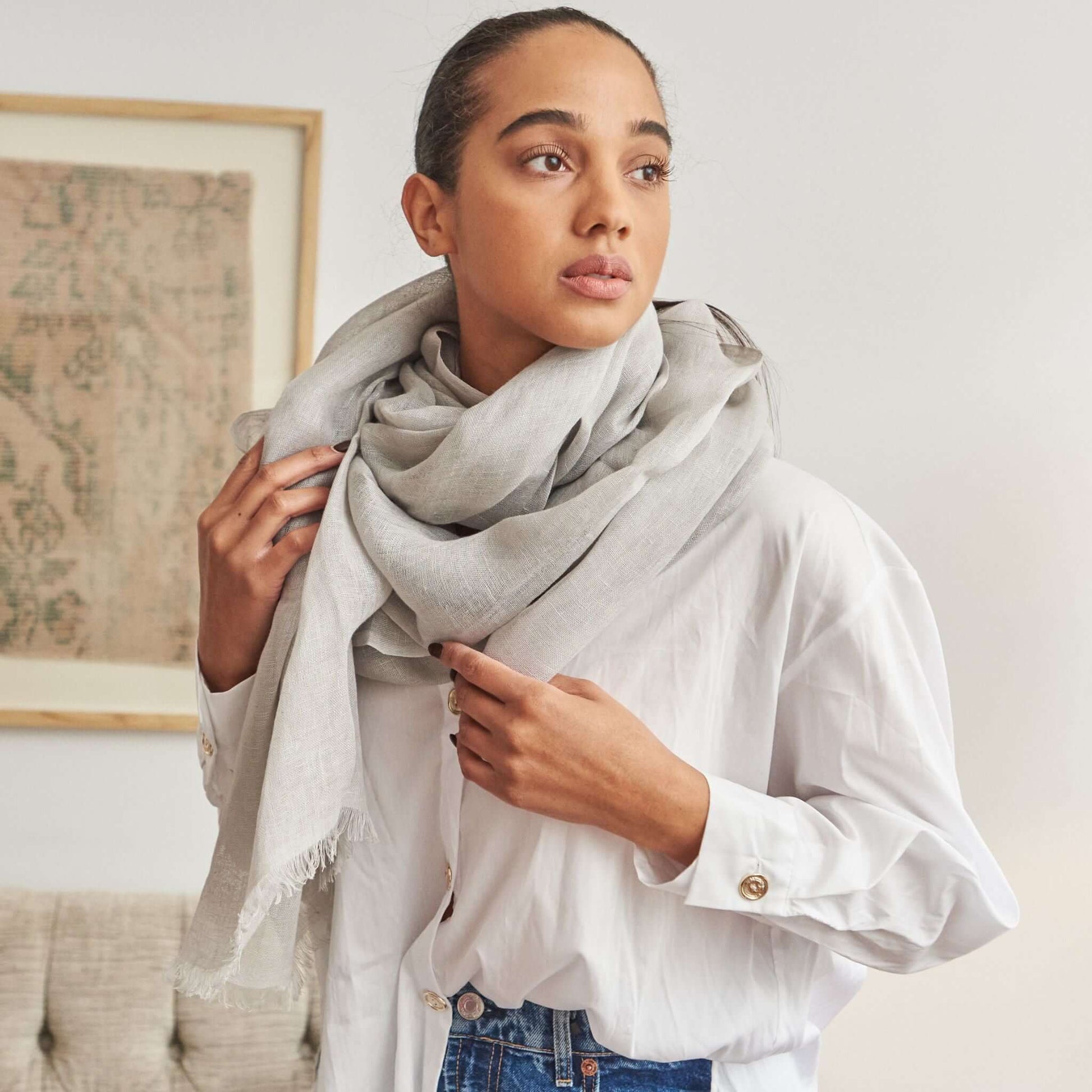 Pebble Light Gray Hand Woven Soft Linen Scarf displayed on a model wearing a white shirt.