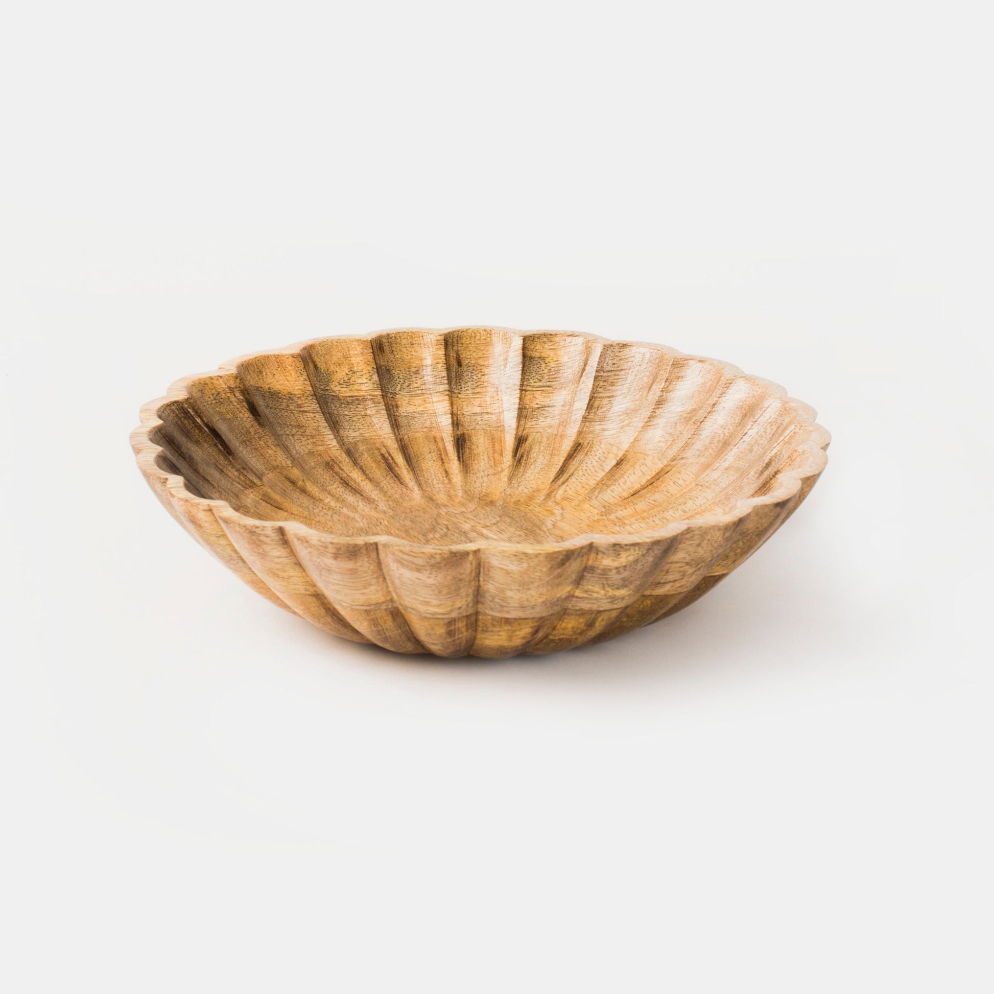 Close-up of carved scalloped pattern and natural wood grain