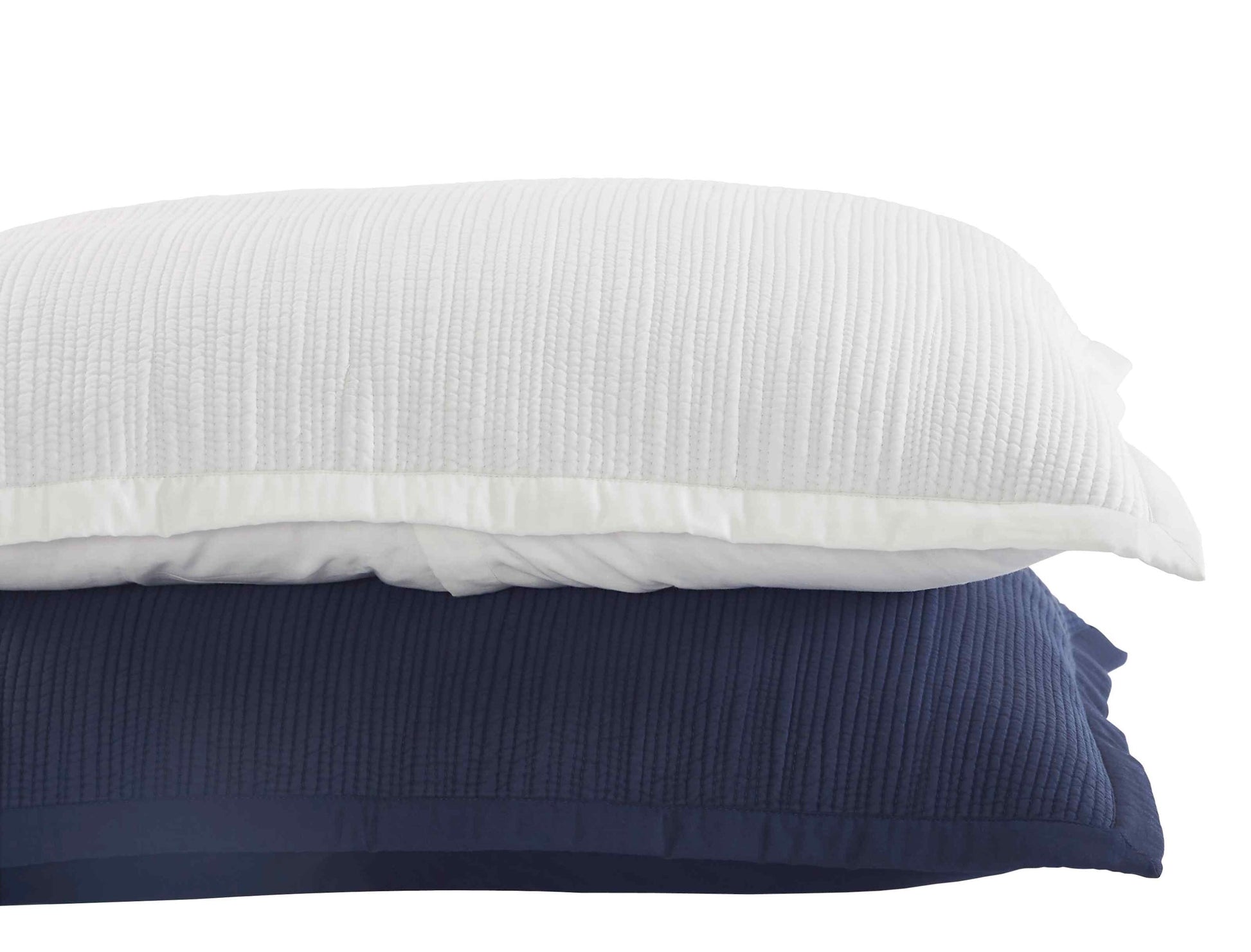 KS-168-2036-PO1269_LOT1_2|Close-up of elegant navy blue quilted ribbed coverlet fabric, luxurious bedding material for a modern bedroom.