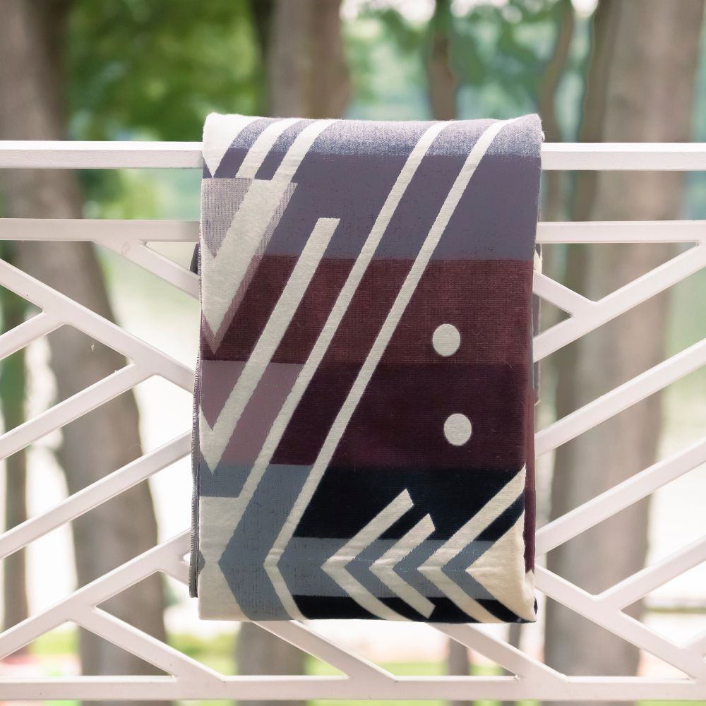 Brown artisanal woven throw with white stripes