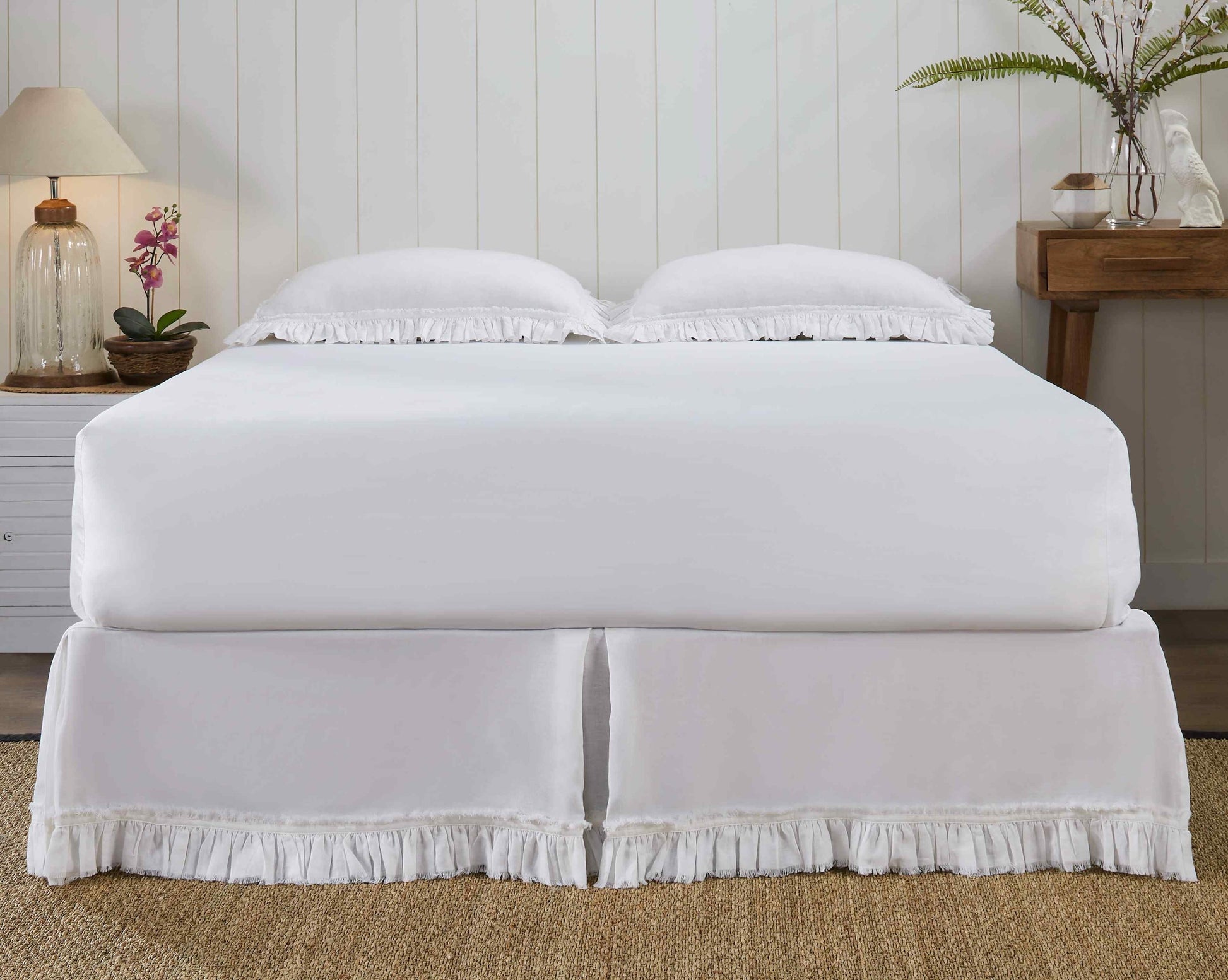 BS-103-6080_2|Full view of a serene bedroom featuring a crisp white linen ruffled panel bed skirt, adding elegant charm to the space.