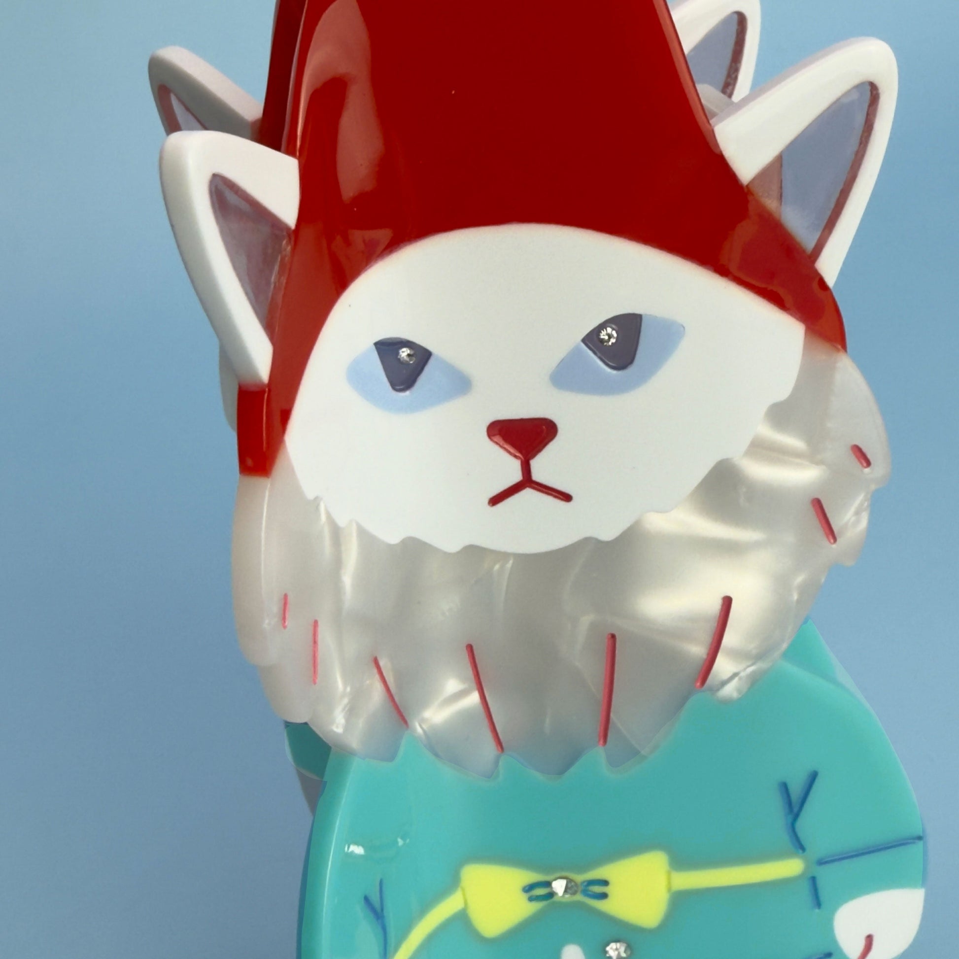 Cat garden gnome From Lawn Ornament to Hair claw Accessory World Traveler in red, blue and pink. Handmade on cellulose acetate, with splice technique, exquisite miniature details and crystals, that are tied directly to its value and make them unique and special. 