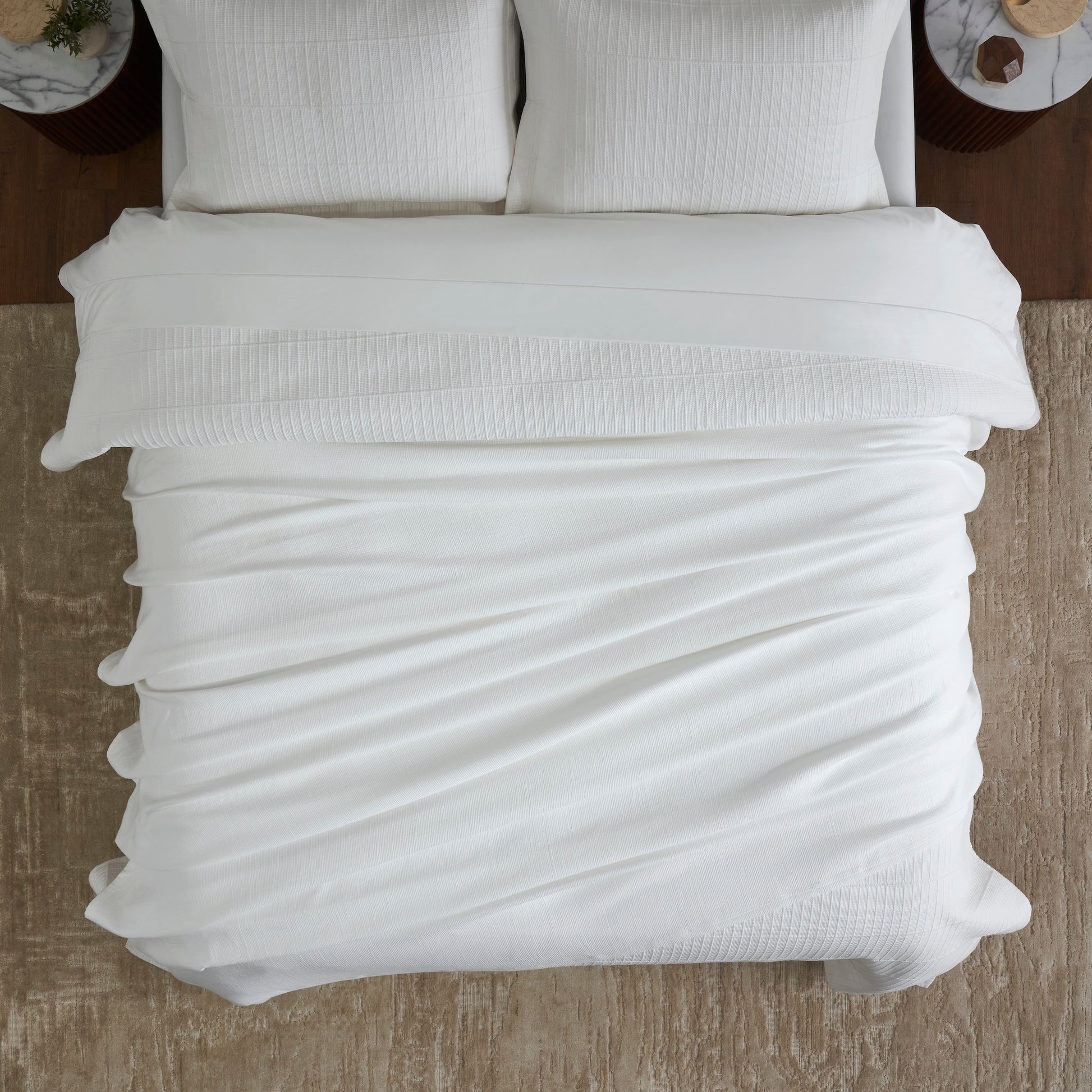 BL-858-9496_4|Soft white textured blanket providing a cozy and inviting feel, perfectly covering the bed in a serene bedroom setting.