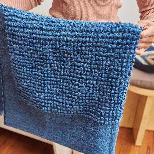 Macaroon Midnight Dark Blue Textured Merino Handloom Throw featuring luxurious handwoven texture.