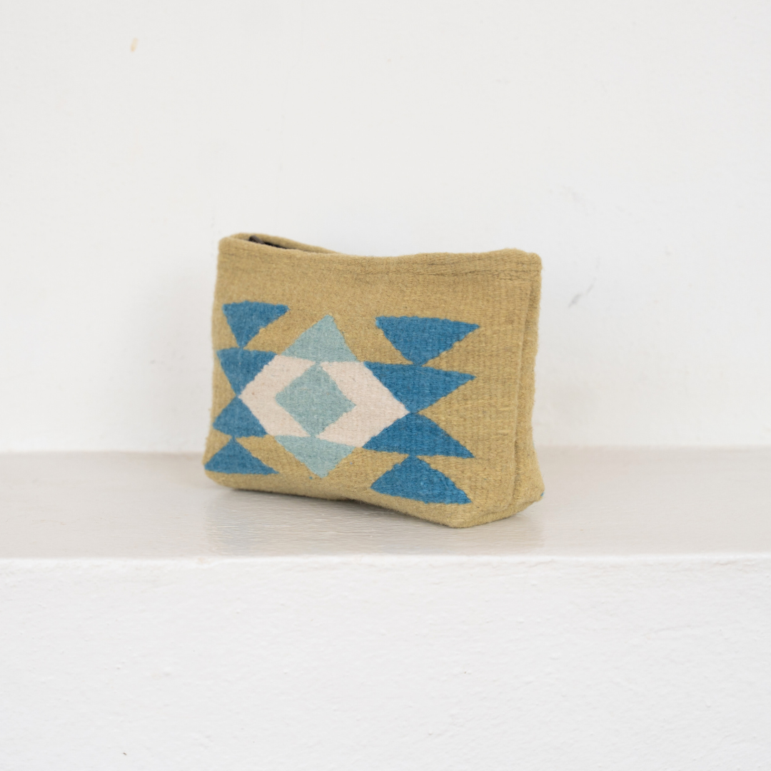 Handwoven pouch with abstract Zapotec butterfly design in bright spring colors, featuring internal pocket; perfect for makeup, wallet, or daily essentials.