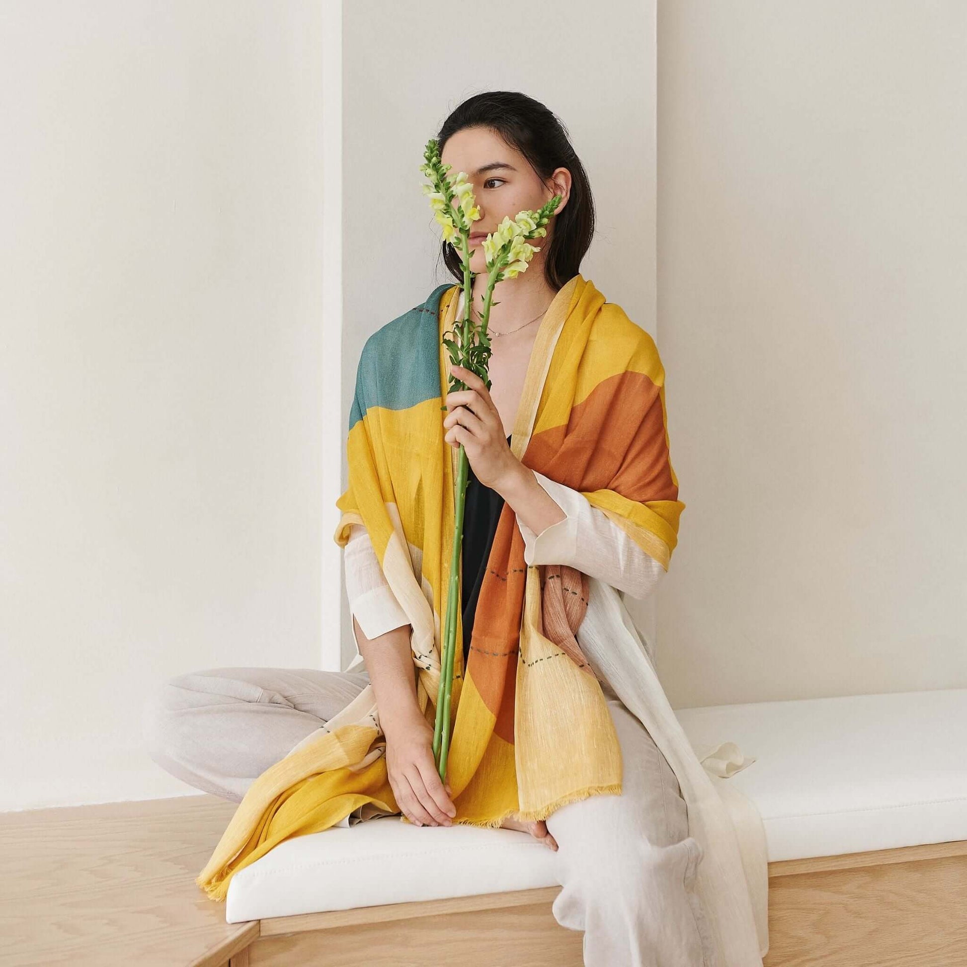 Cirq Sun Yellow Green Circle Pattern Hand Embroidered  Linen Silk Handloom Scarf worn by model with flowers.