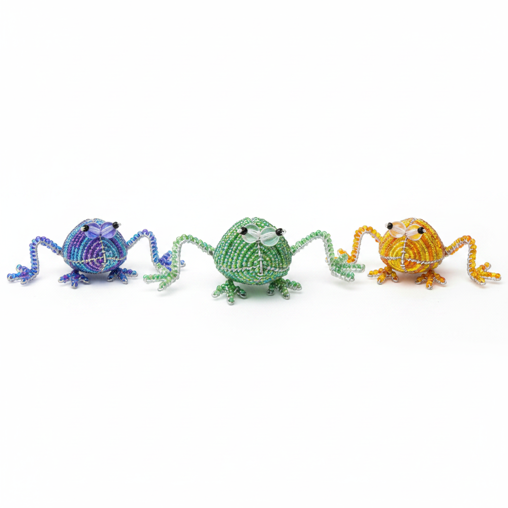 Set of 3 hand-sculpted beaded miniature frog figurines on white background