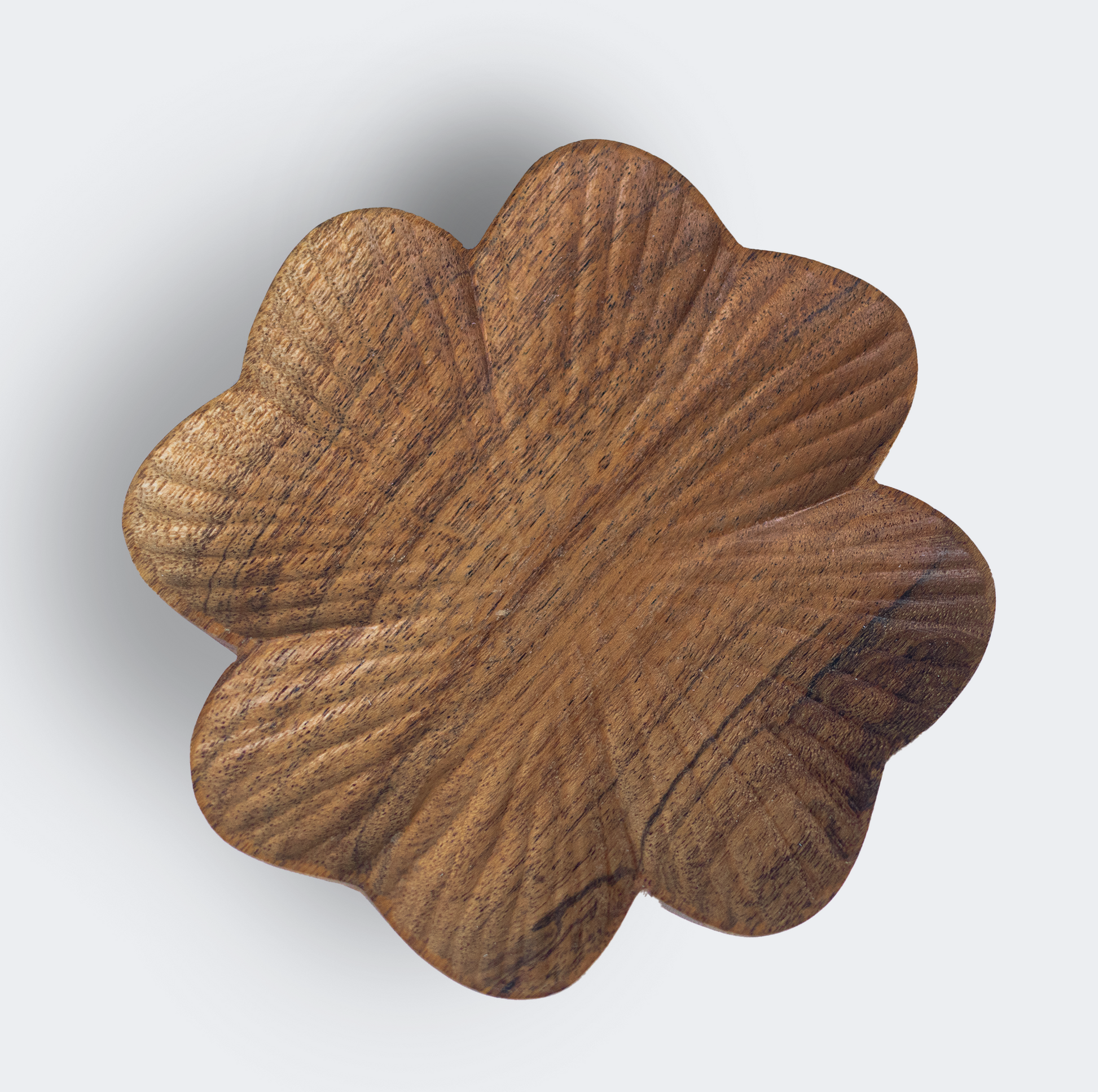 Close-up of hand-carved wood texture and natural grain on trinket tray