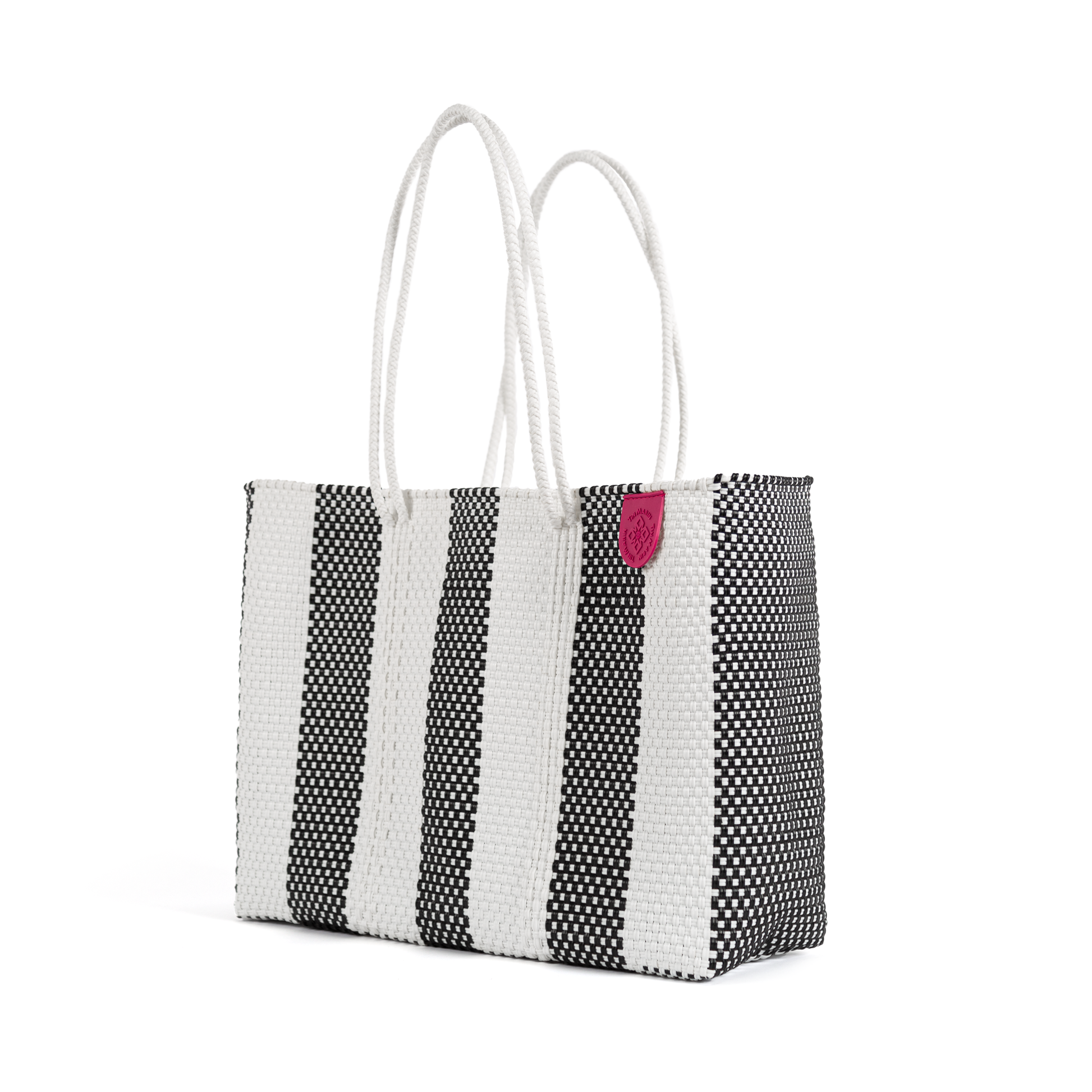 Tin Marin super tote in Zebra Design, A black and white striped oversized tote bag with a purple pompom decoration, and a shoulder strap.