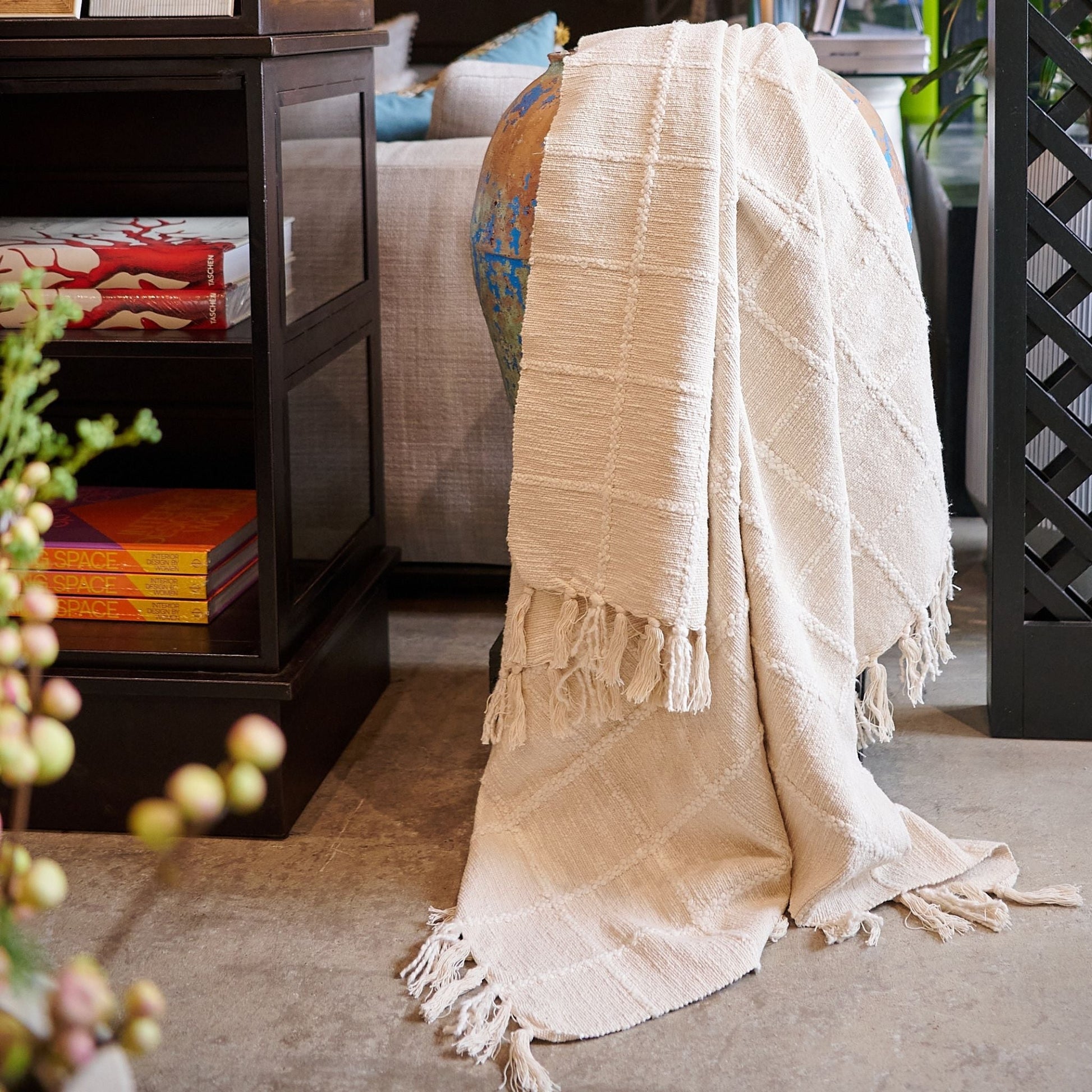 Sea Shell White Textured Checks Handloom Throw draped elegantly over a table in a modern living space.