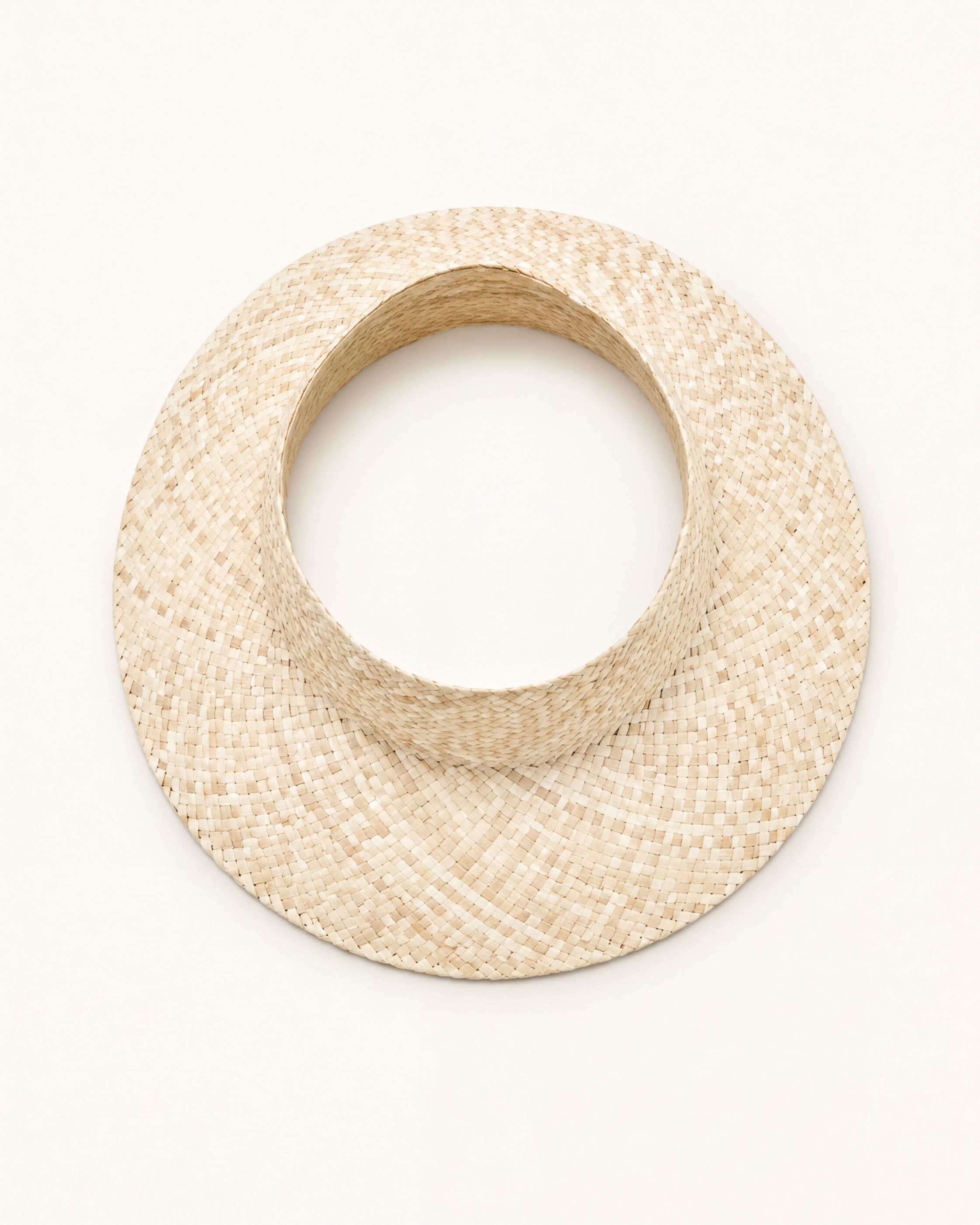 A straw hat with a round brim is shown against a plain white background.