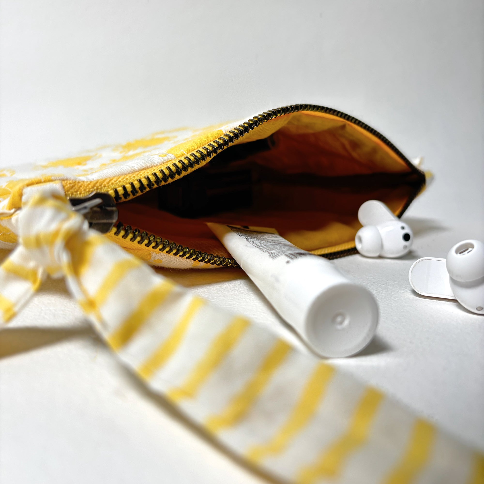 Quilted Cotton Travel Pouch with Sun Print and Ruffle Trim